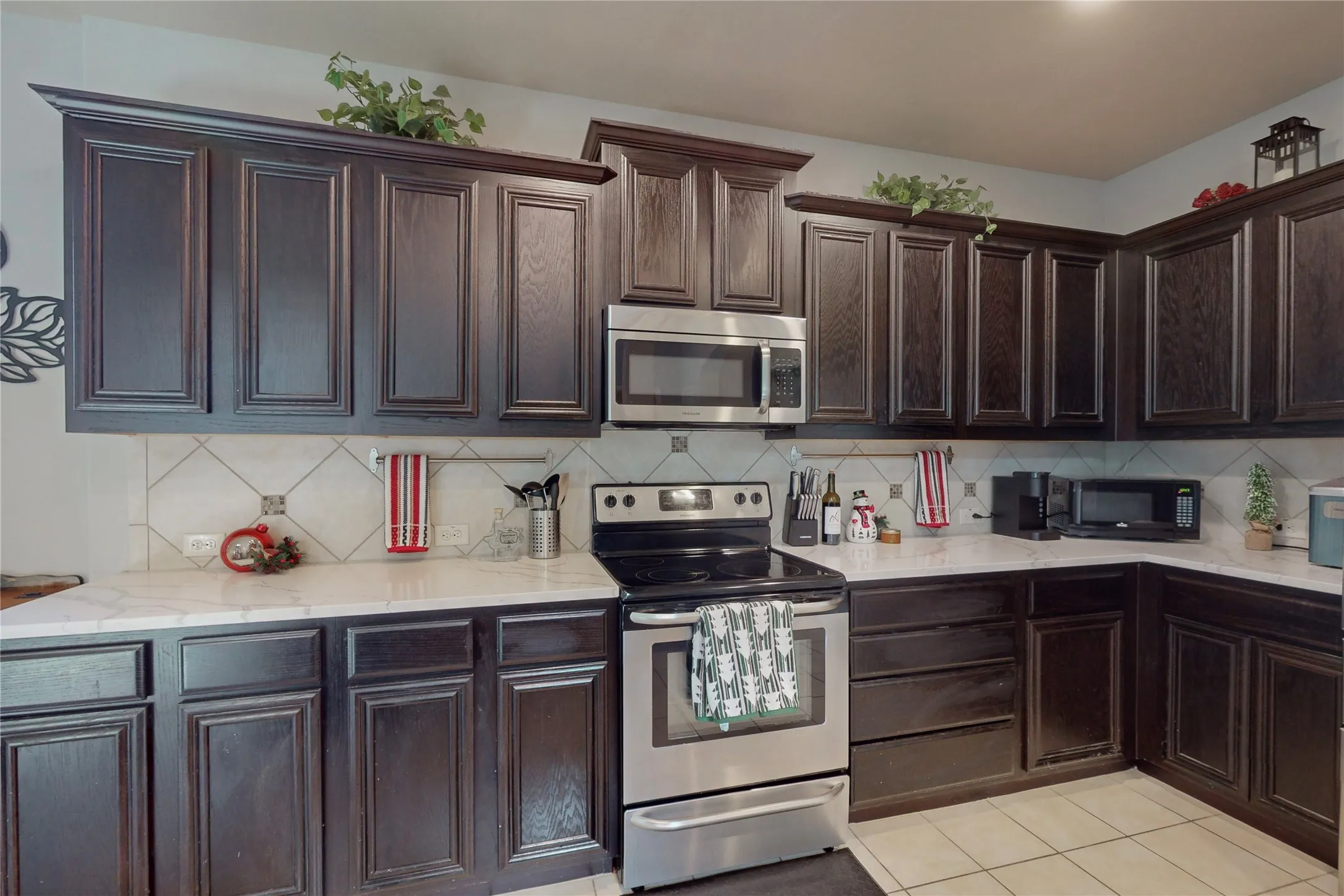 Lovely kitchen with quartz counters.