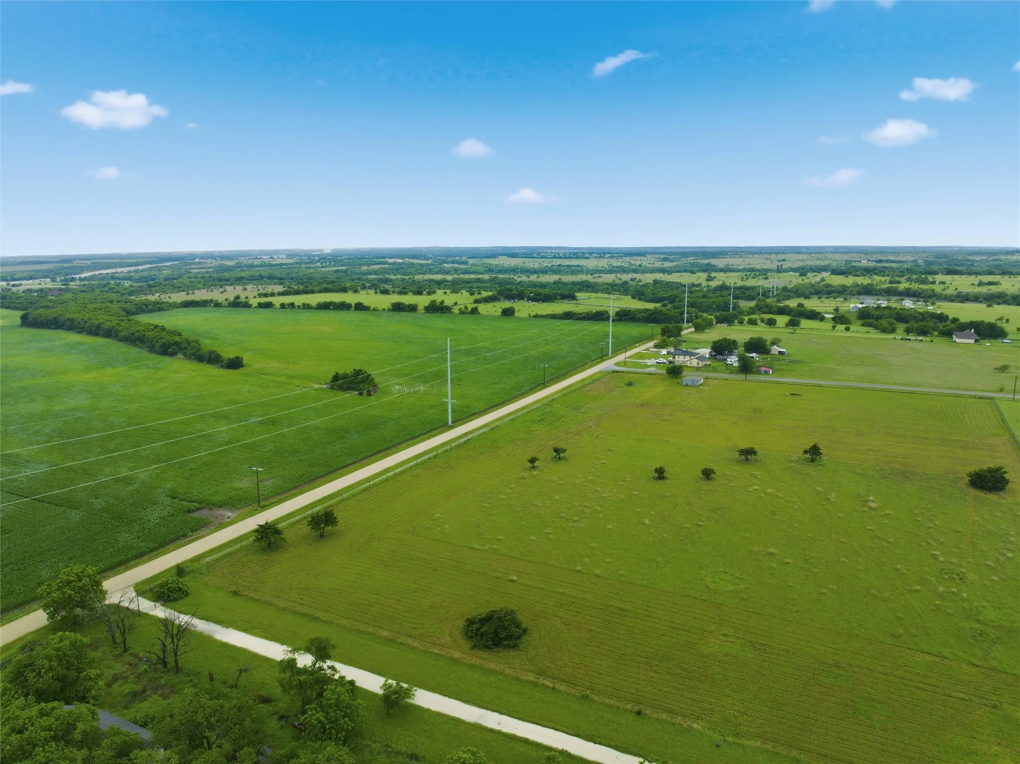 Expansive green acreage with a long private road