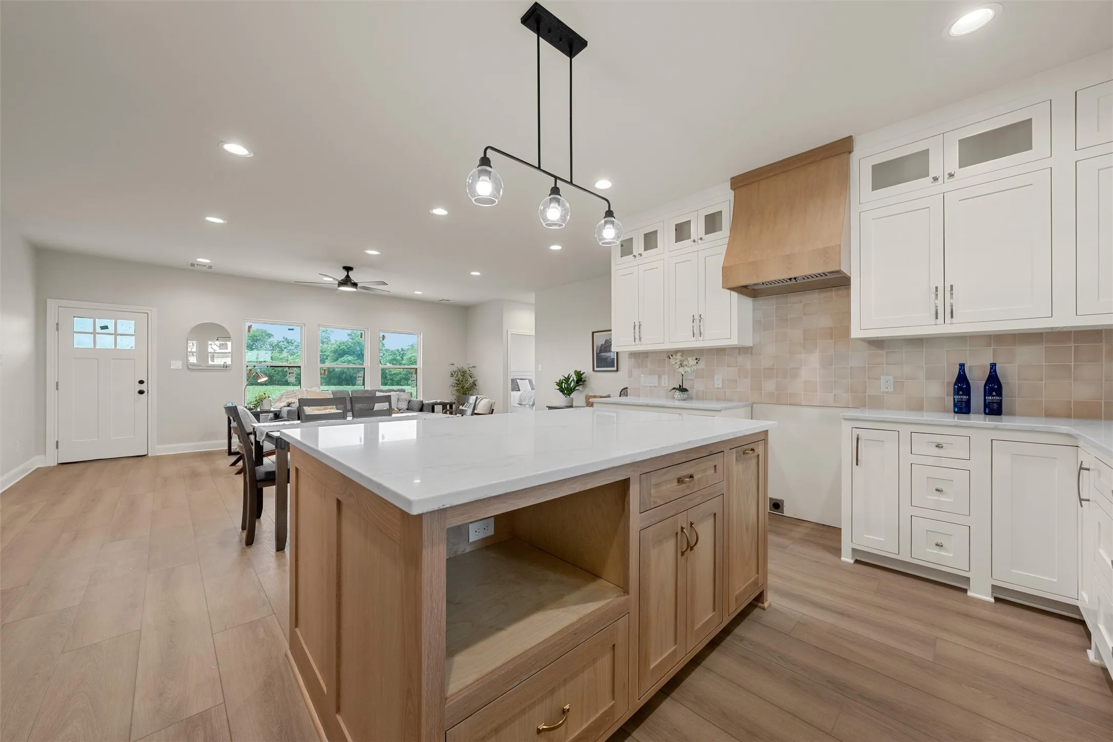 Kitchen island featuring a white countertop and light wood-finish cabinetry