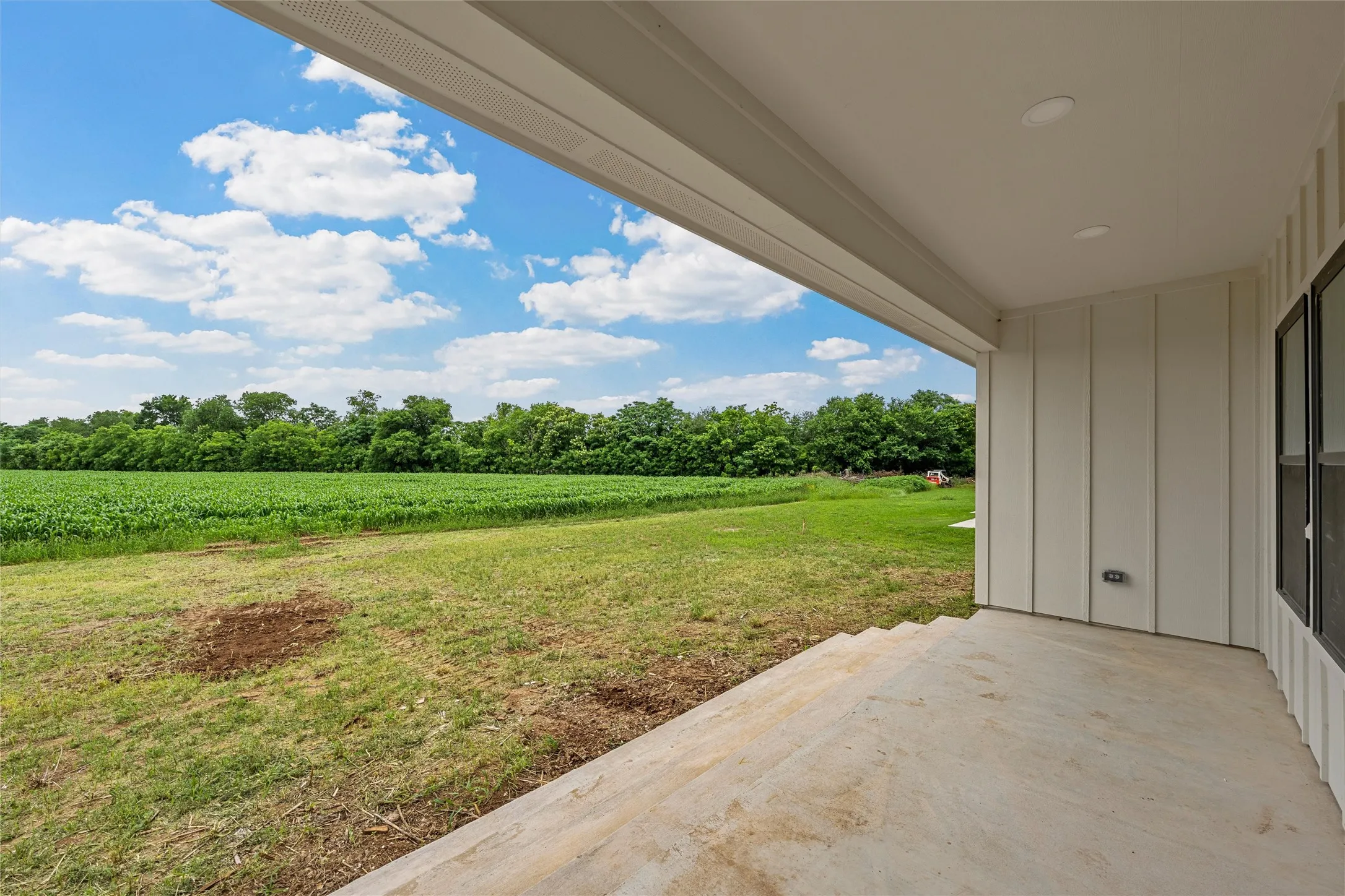 Expansive covered patio featuring a concrete surface and recessed lighting