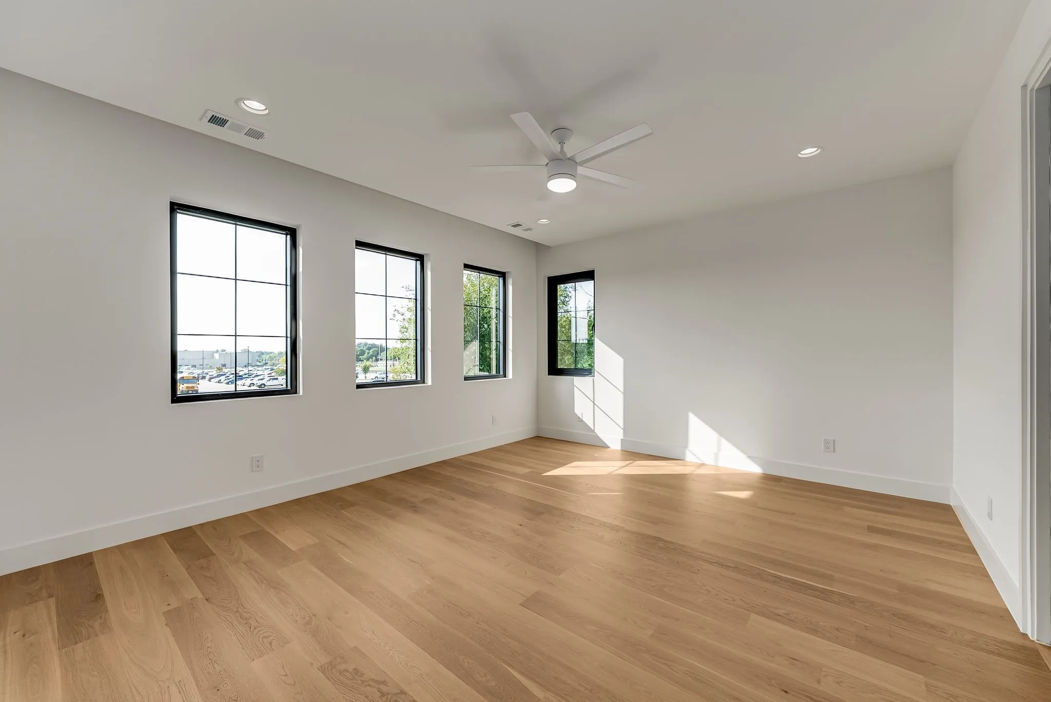 Spare room with recessed lighting, light wood finished floors, and a ceiling fan