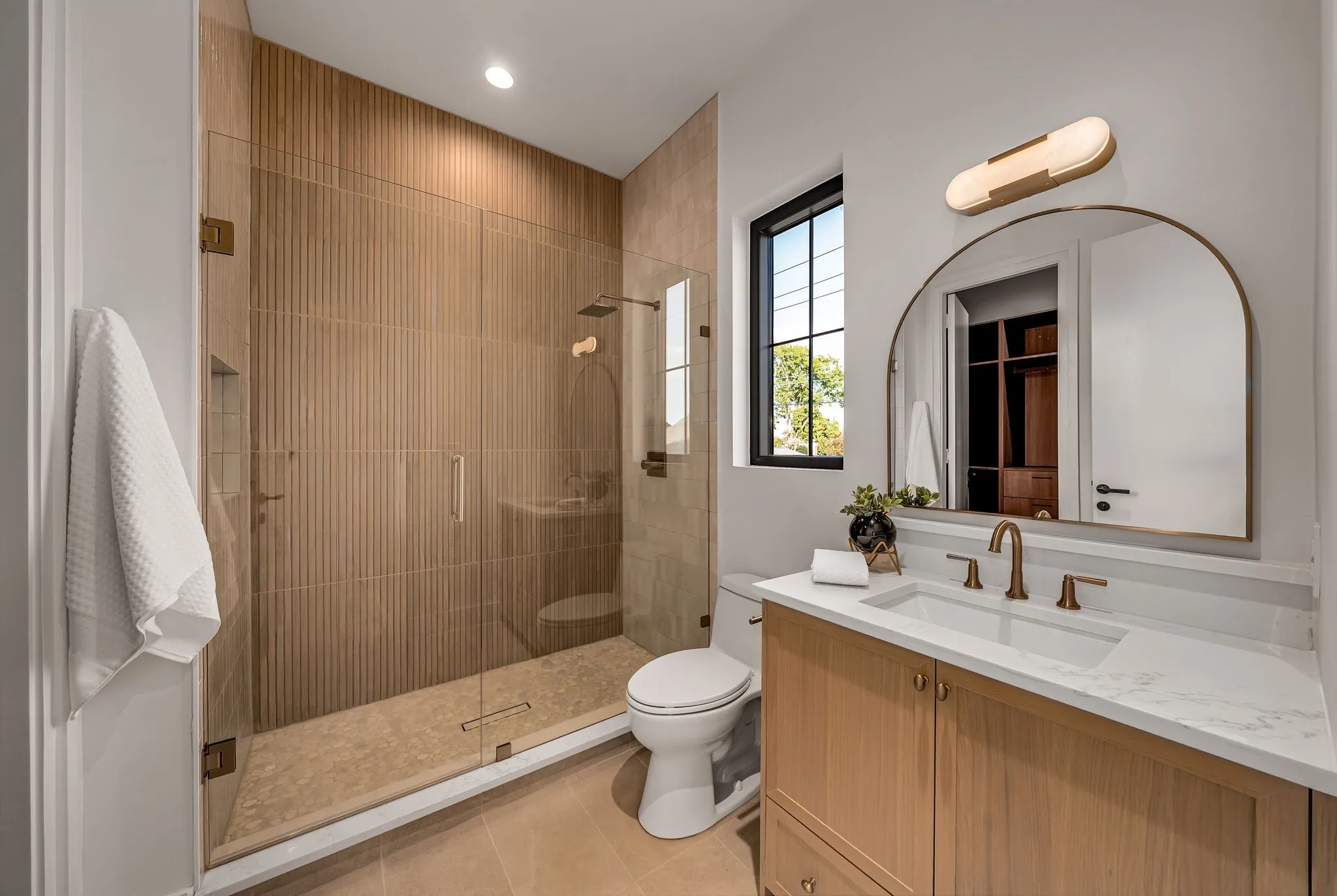 Full bath featuring vanity, a shower stall, light tile patterned floors, and recessed lighting