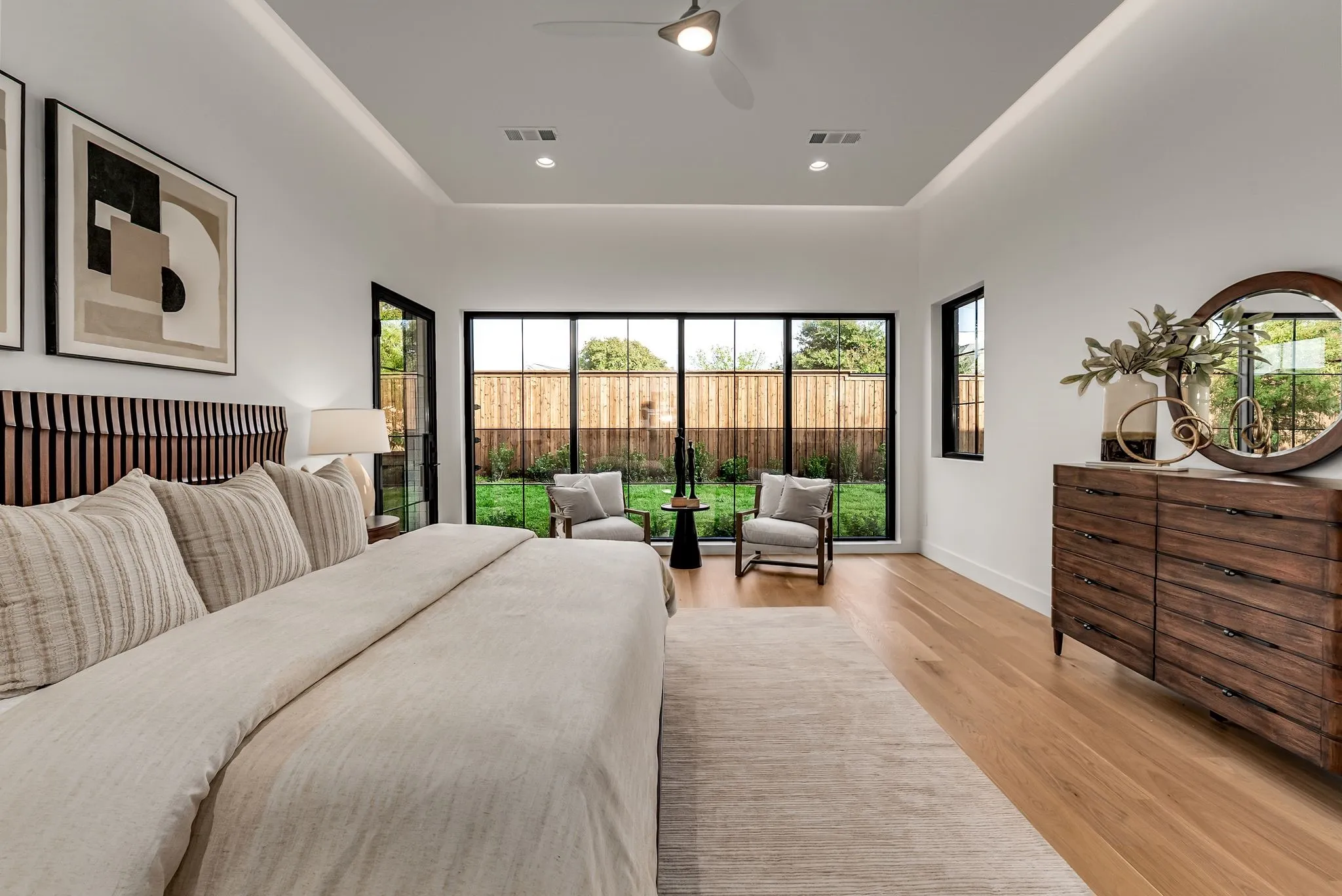 Bedroom with multiple windows, light wood-style floors, recessed lighting, and ceiling fan