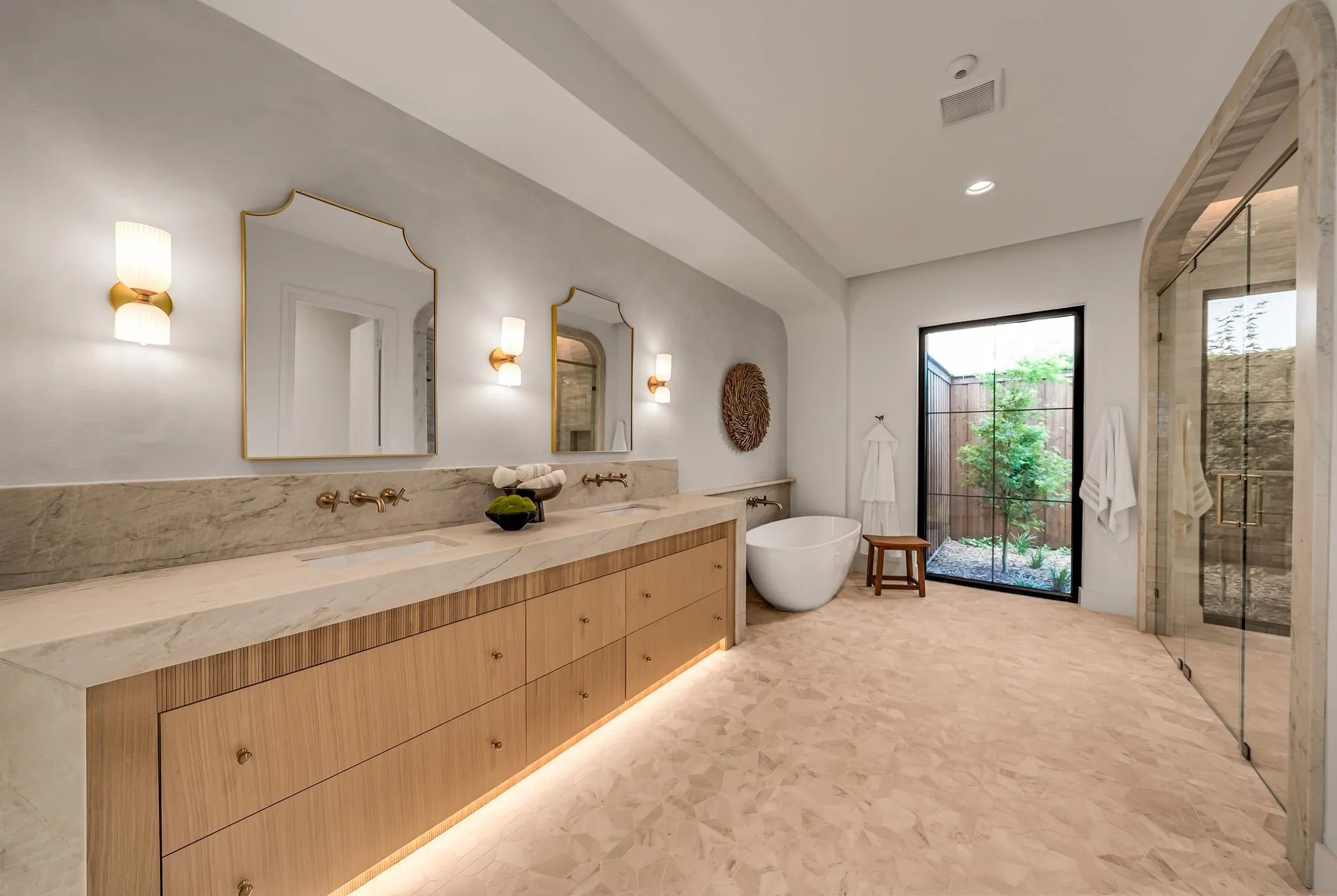 Full bath featuring double vanity, a soaking tub, a stall shower, and recessed lighting