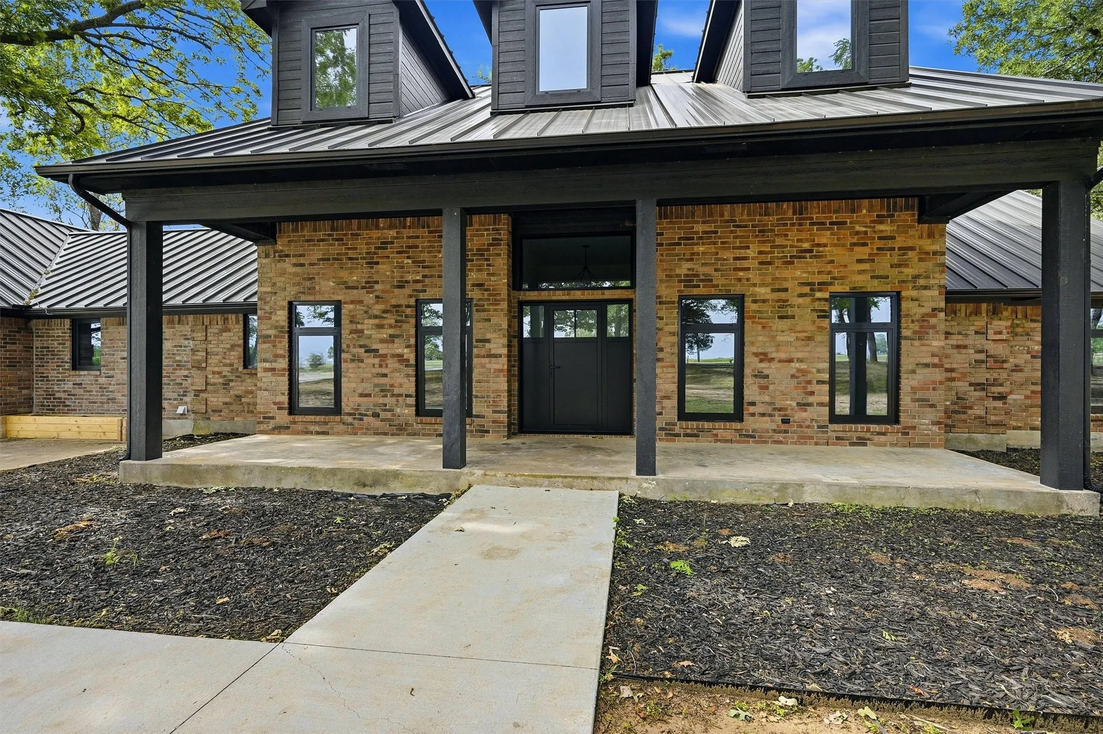 Large open porch to double door entry