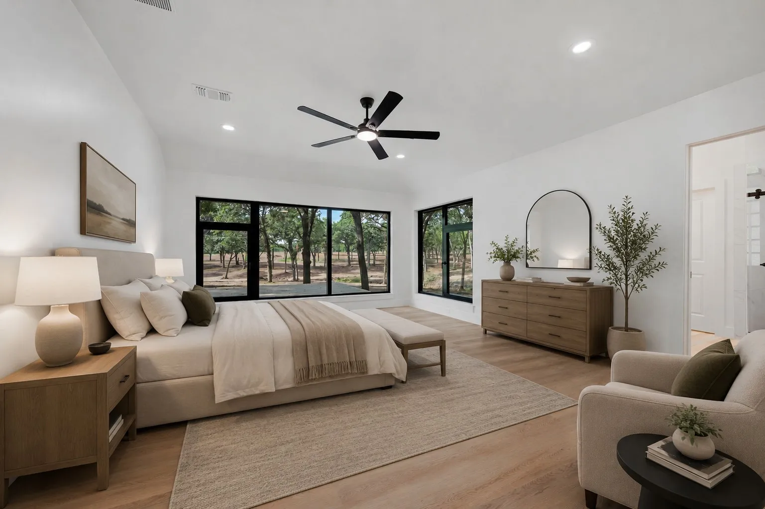 *Virtually Staged* featuring large windows, wood-finish flooring, a contemporary ceiling fan, recessed lighting, and a built-in barn door