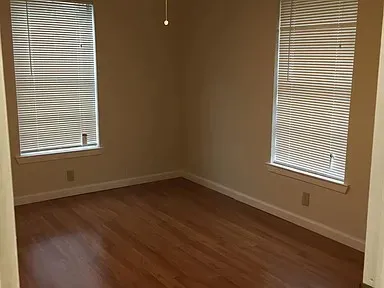 Hardwood-finish flooring throughout, complemented by neutral wall tones