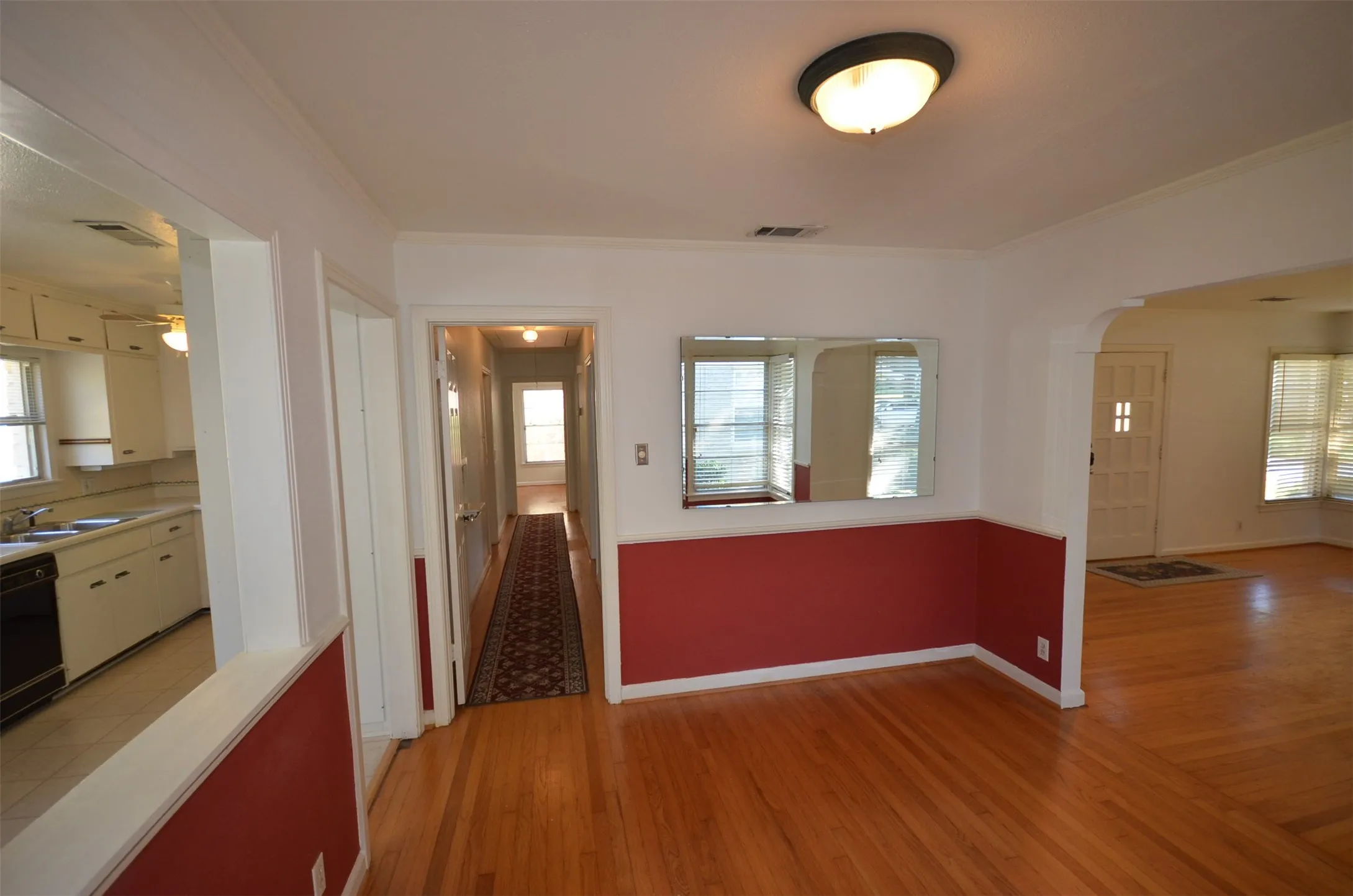 Hardwood flooring throughout the main living areas and hallway