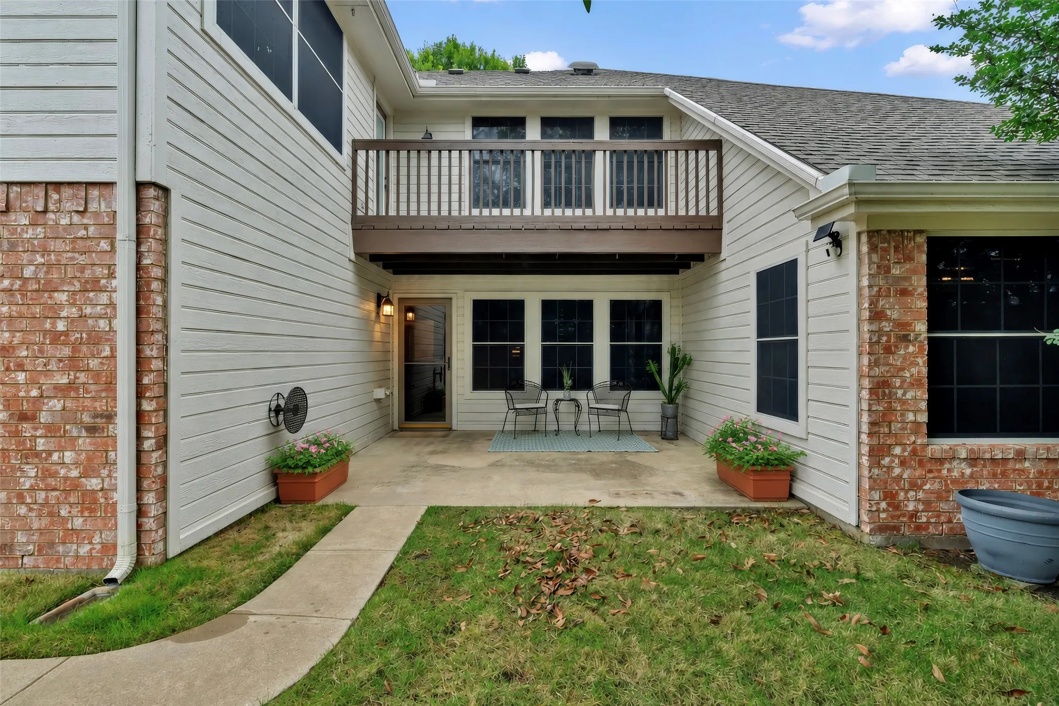 Back porch is accessible to the entire back yard including the garage entry and the two sheds