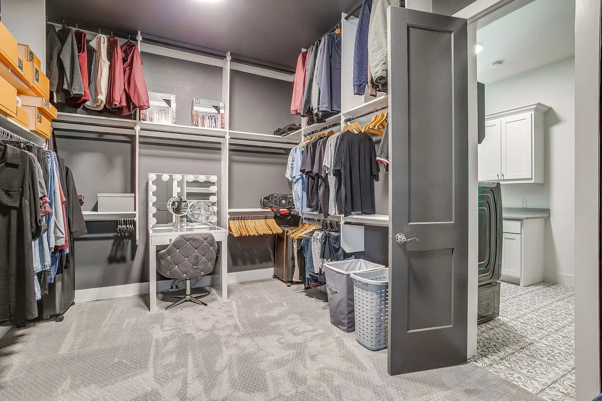 Large primary closet that leads to utility room.