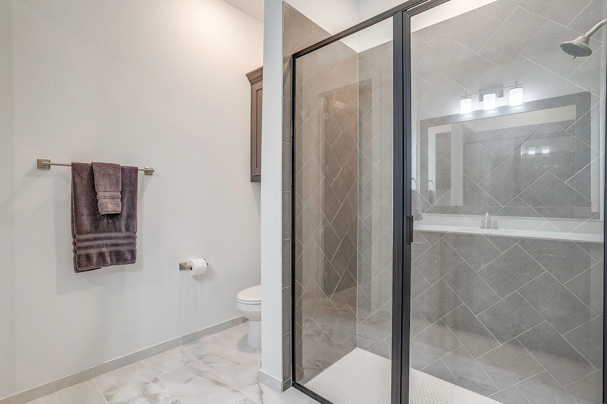 Third full bath with walk-in shower.