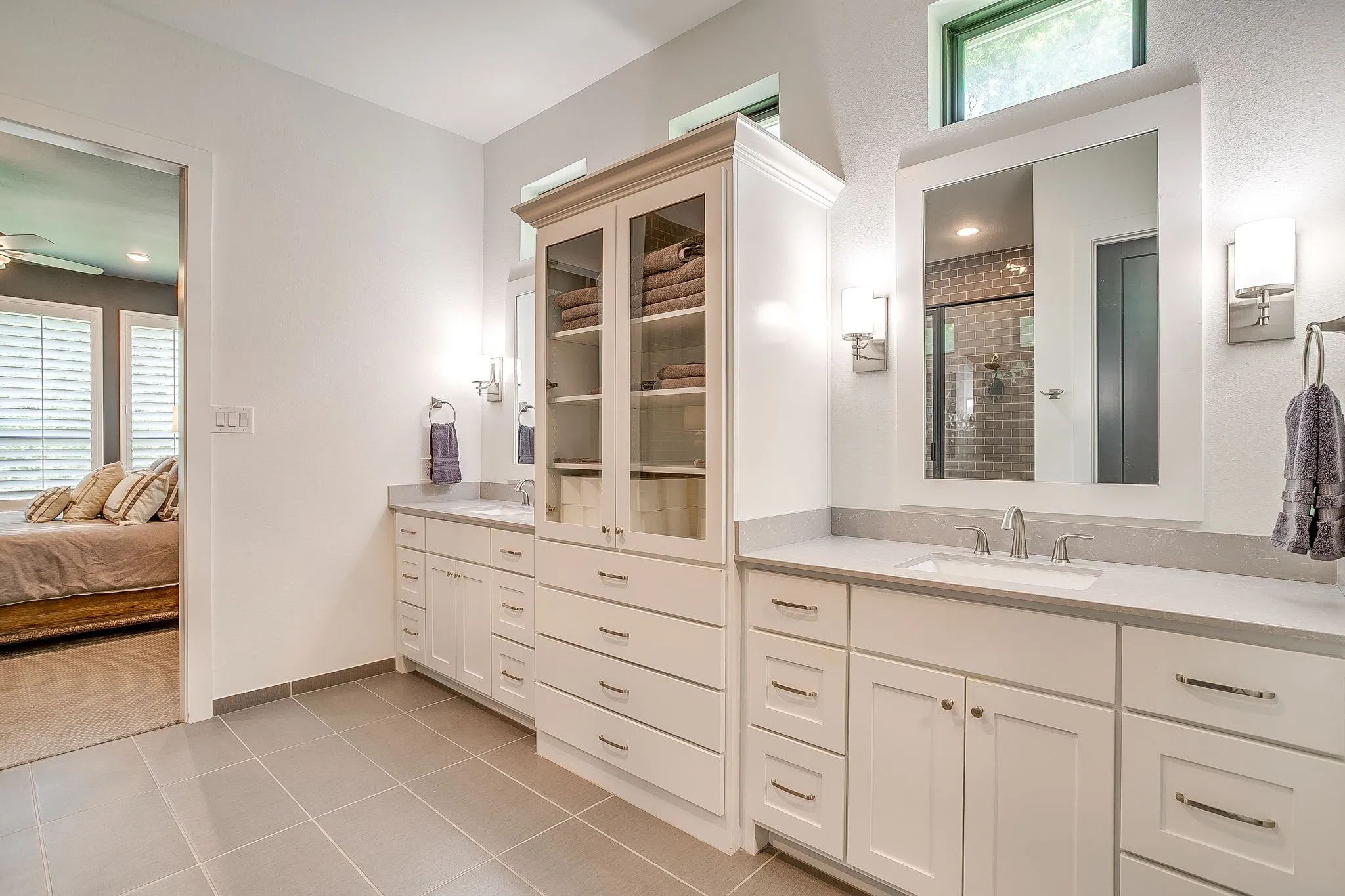 Primary bath with tile flooring.