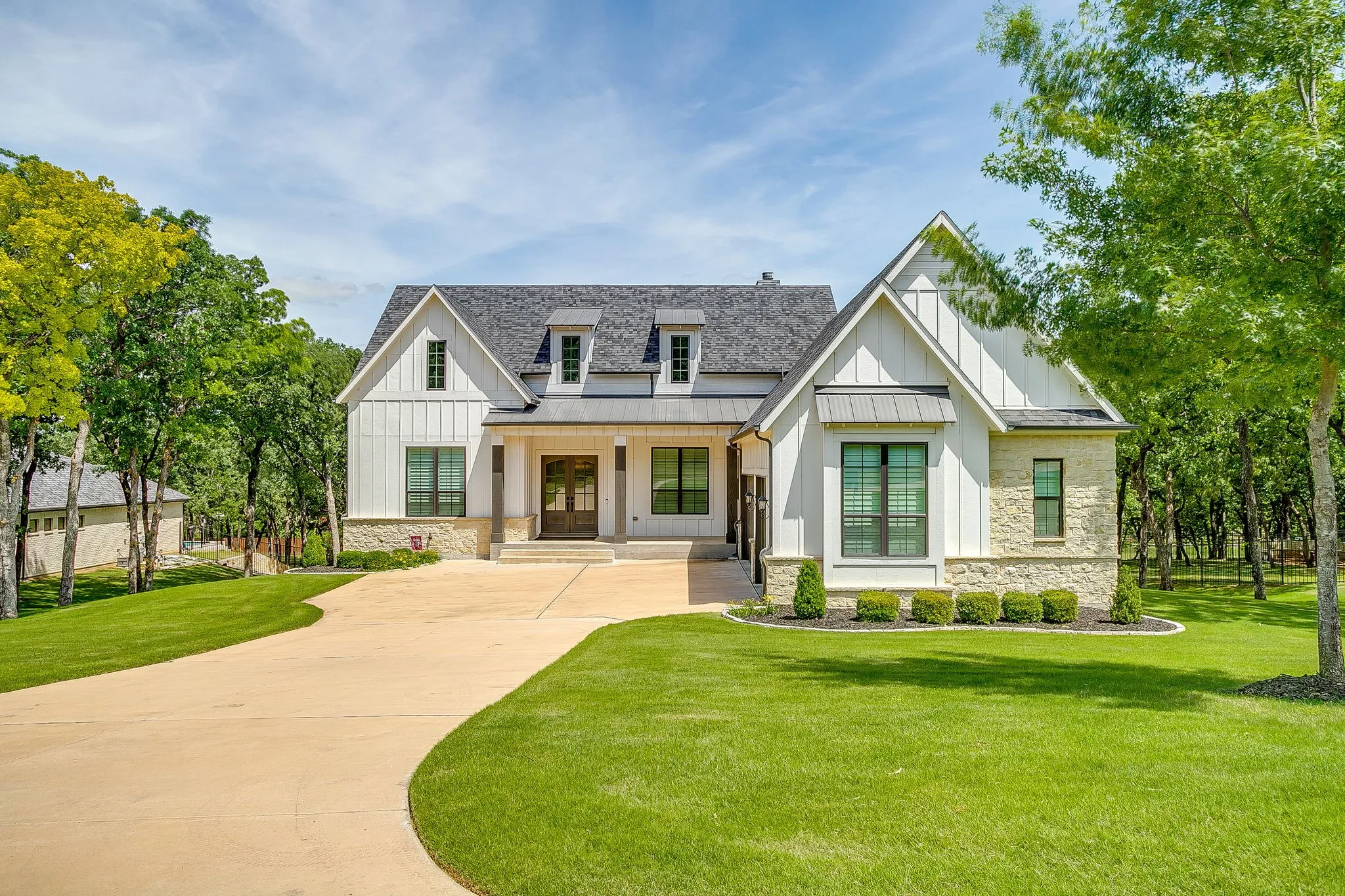 Yard is beautifully landscaped & heavily treed.