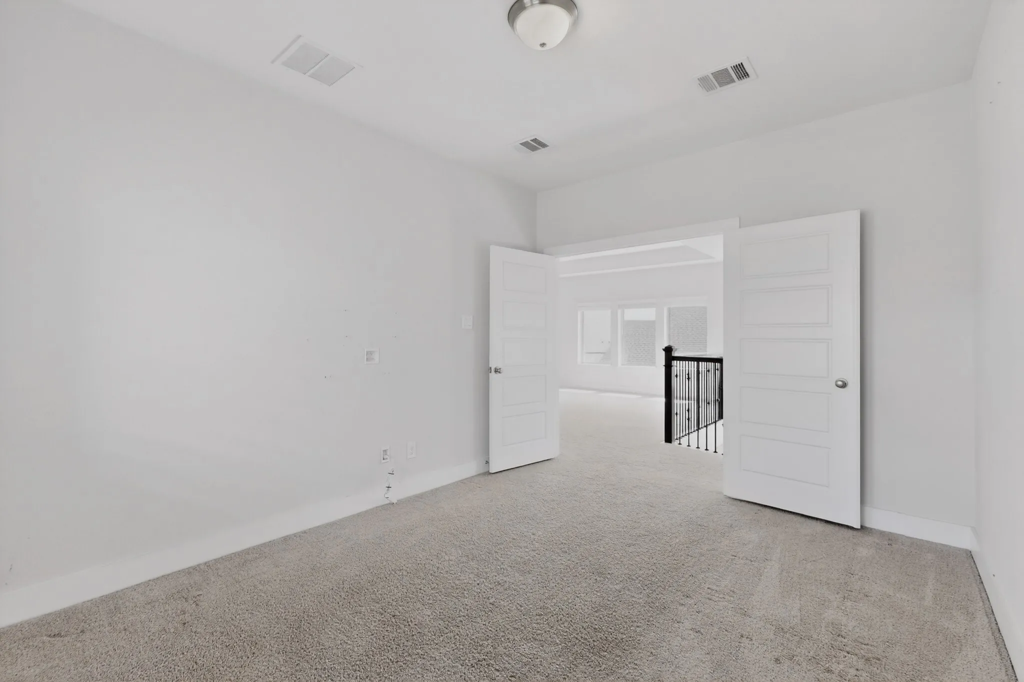 Neutral-toned carpeting throughout