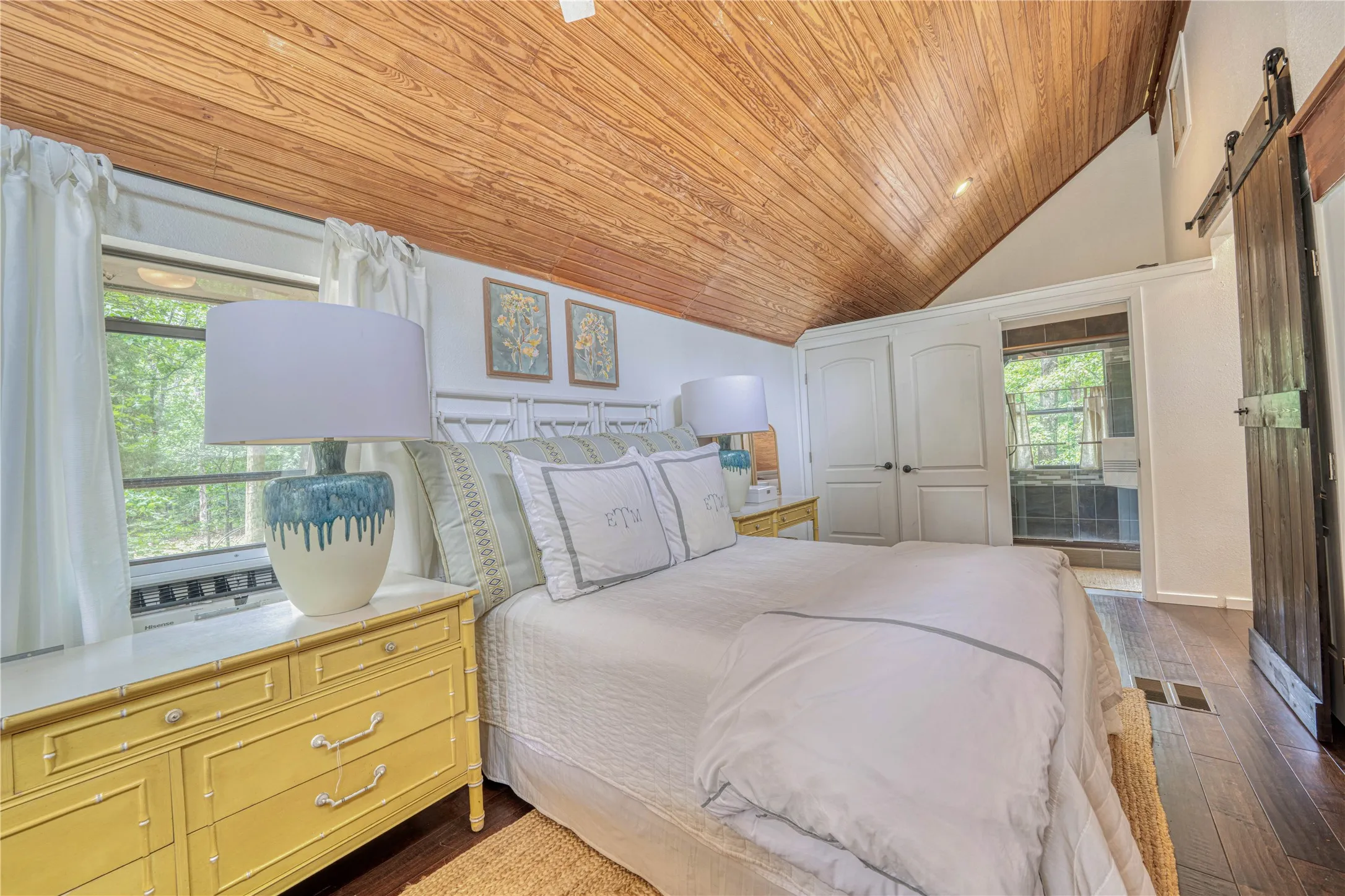 Vaulted wood-finish ceiling with recessed lighting