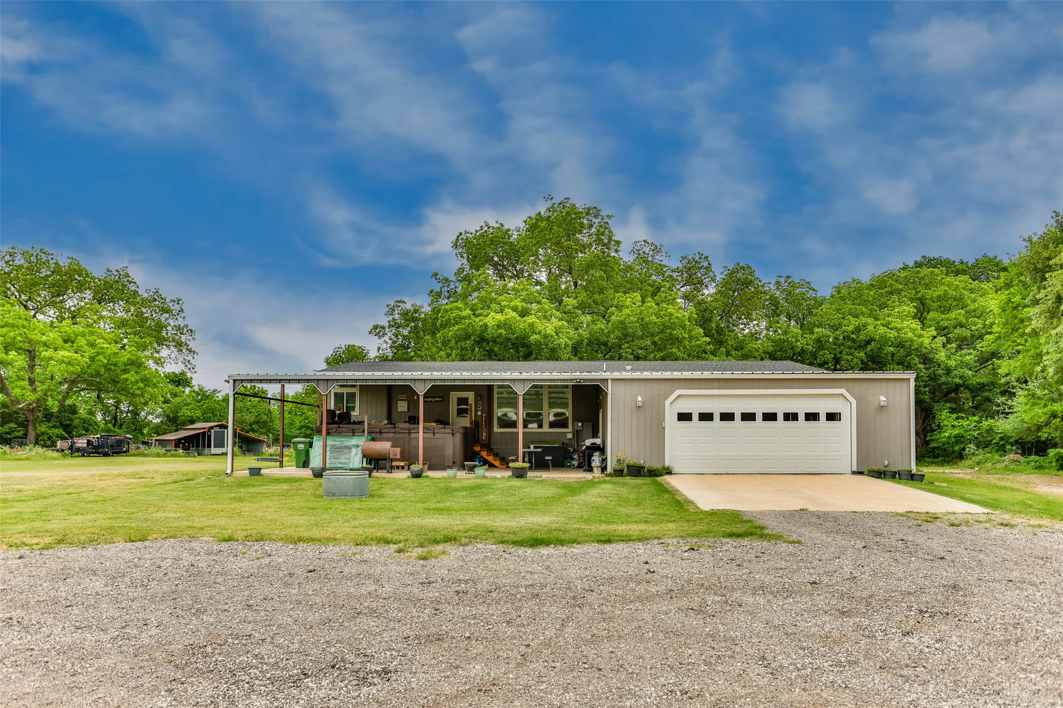 Back of home with carport