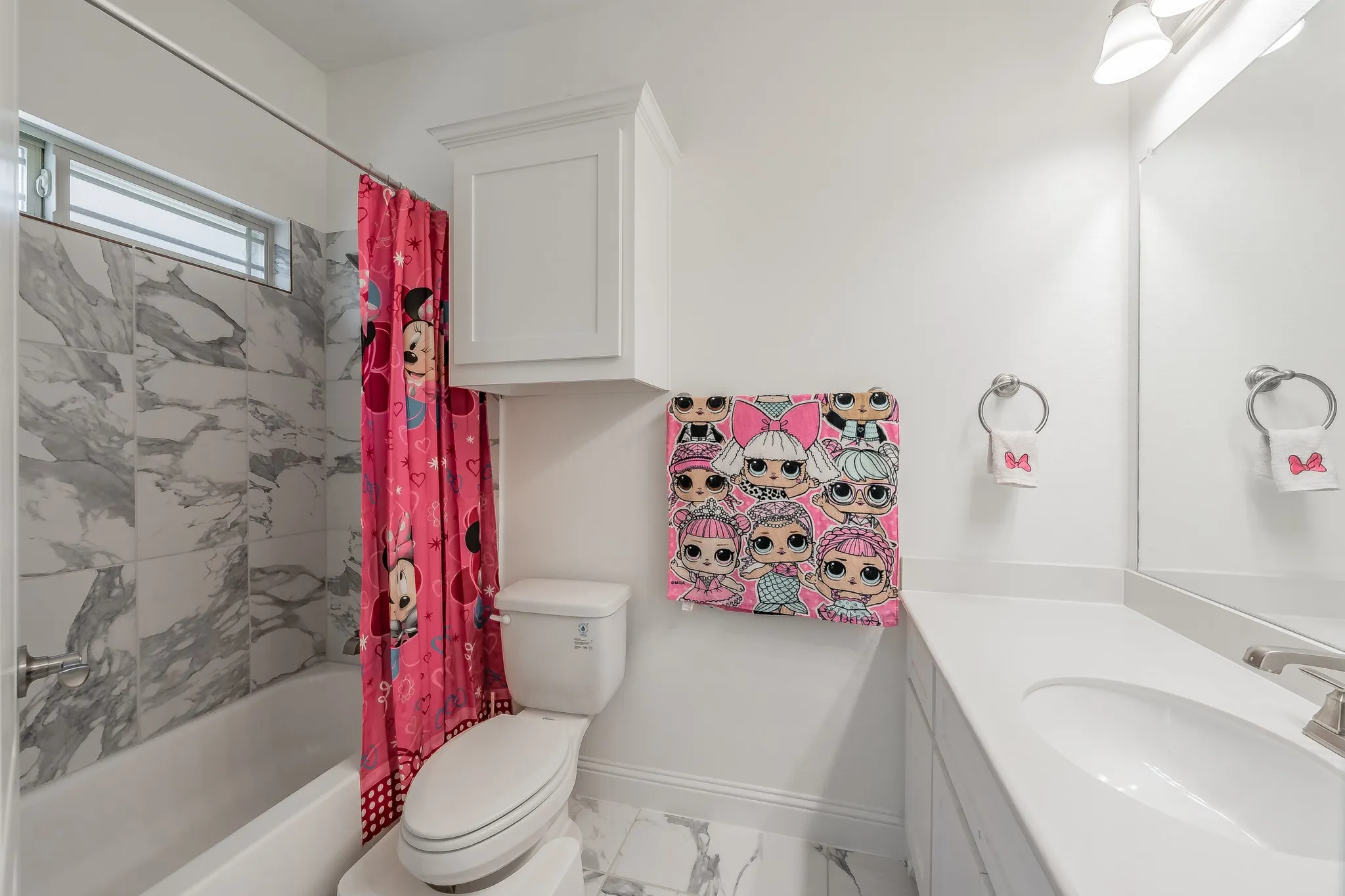Full bathroom featuring toilet, shower / tub combo and vanity