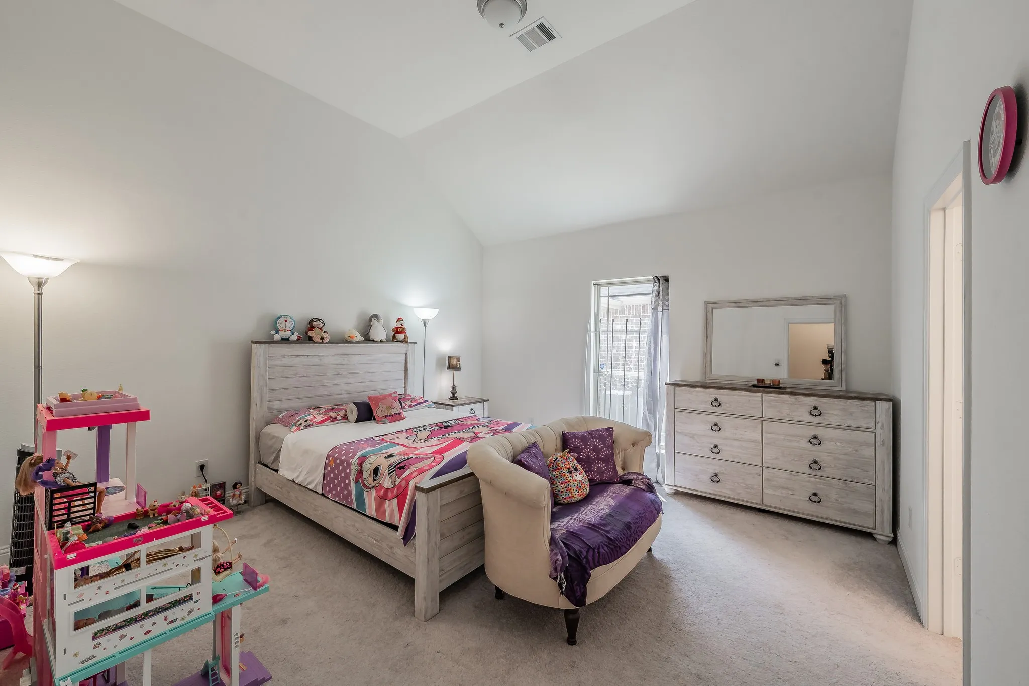 Carpeted bedroom #2 with vaulted ceiling