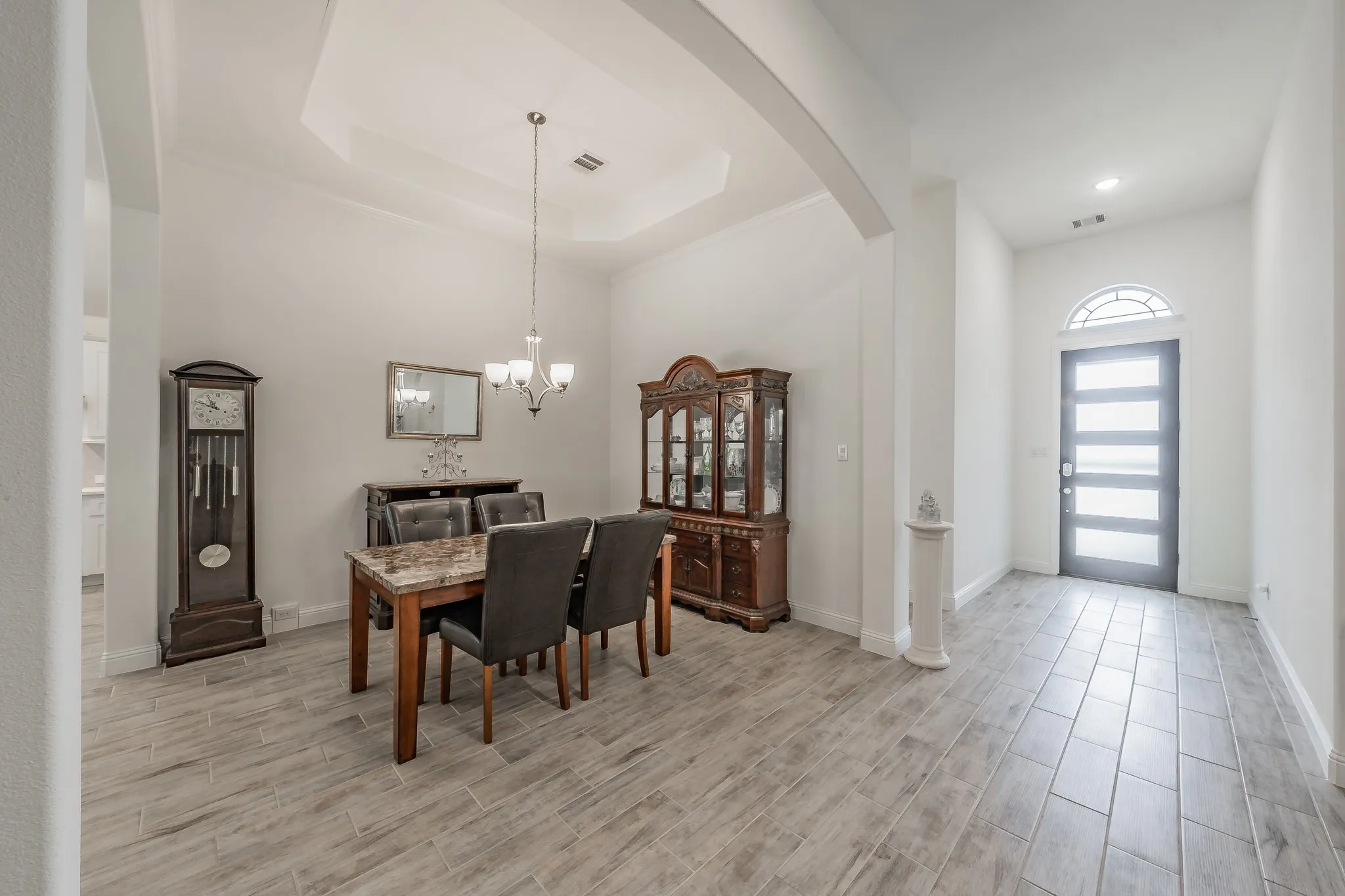 Dining area featuring ornamental molding, space for a larger dining set