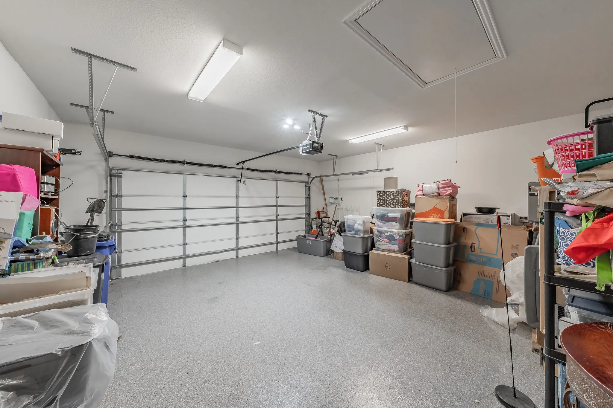 2 car garage with epoxy floor and attic access