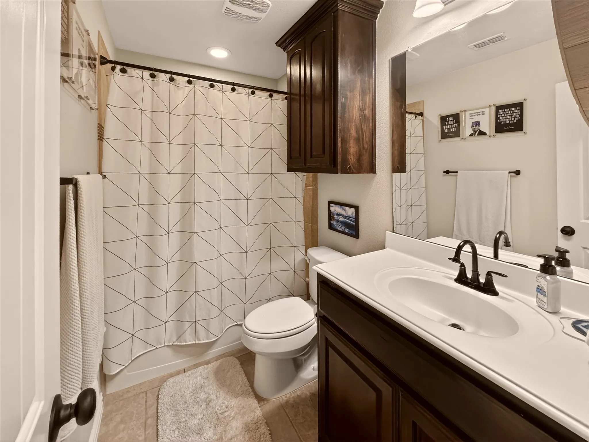 Additional full bathroom includes a tub-shower combination and convenient storage.