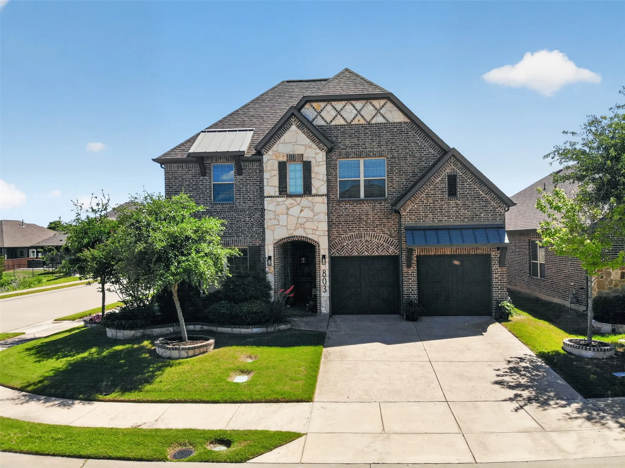 Distinctive exterior, mature landscaping and a corner-lot setting create strong curb appeal.