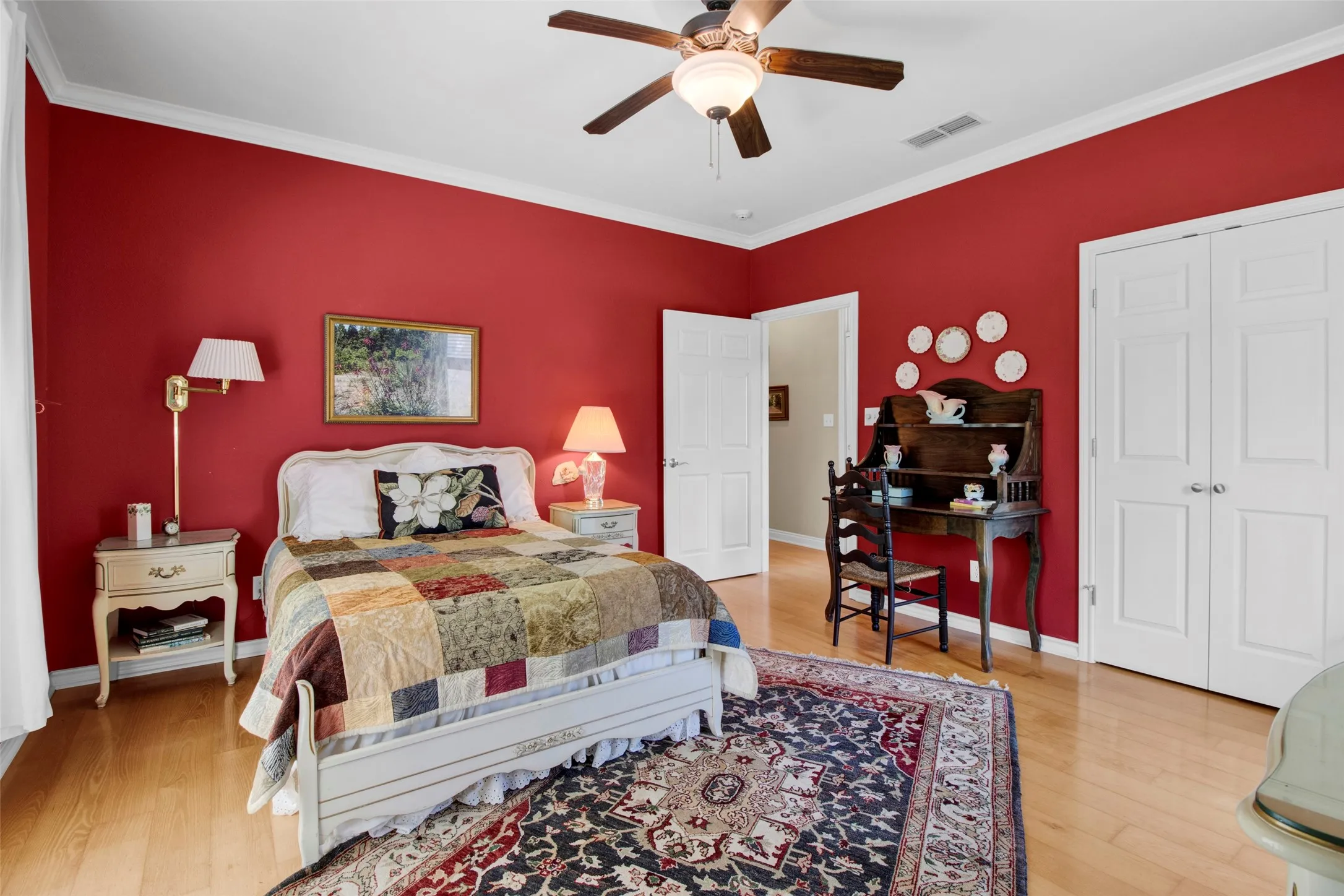 Bedroom #3 featuring wood flooring, a ceiling fan with integrated lighting, and white crown molding, ample Closet space -