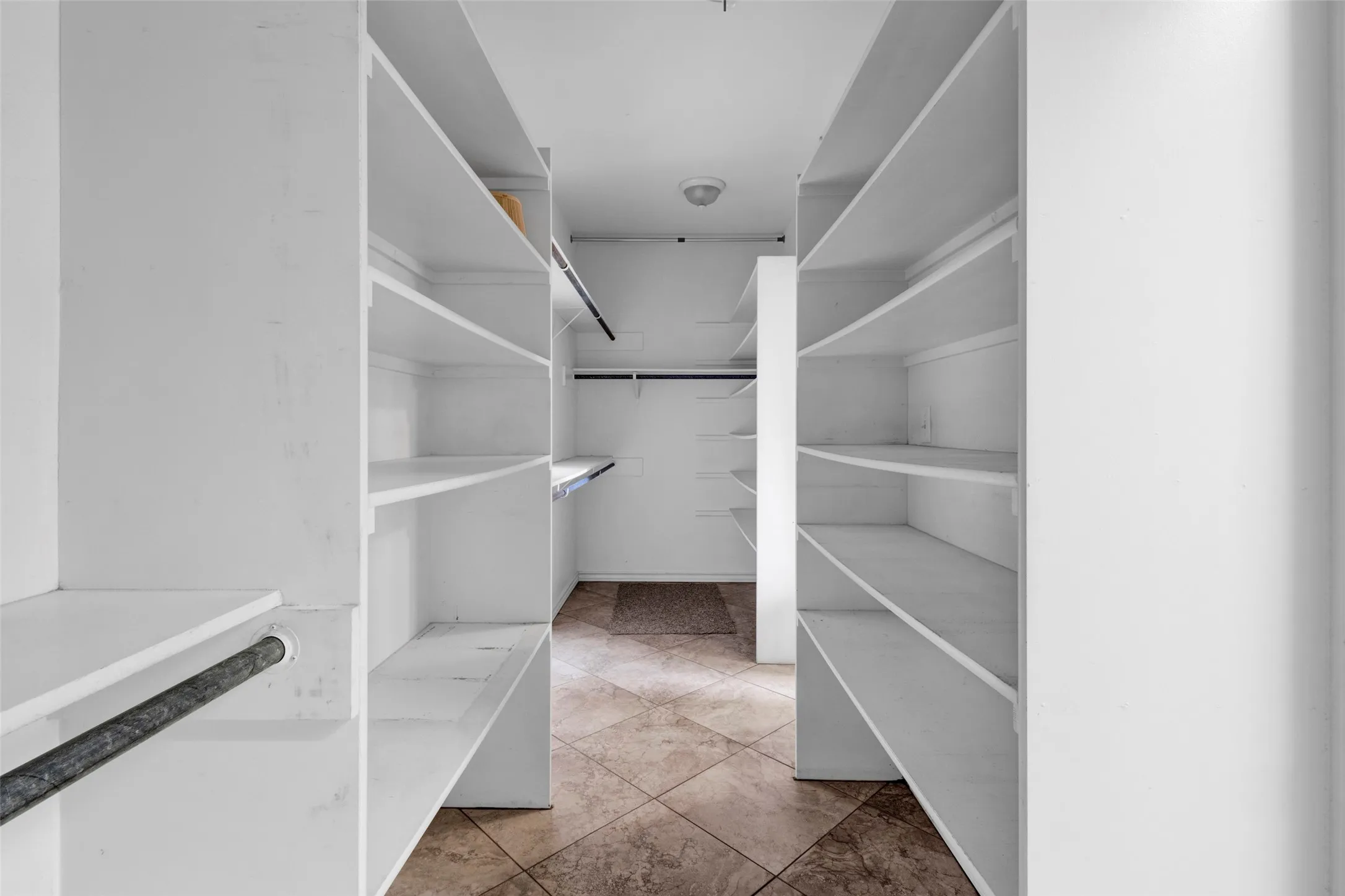 Primary suite - walk through closet with lots of storage for clothes, shoes, handbags, - and even some room for your spouse's things. - Easy walk through to your Laundry Room from the Closet