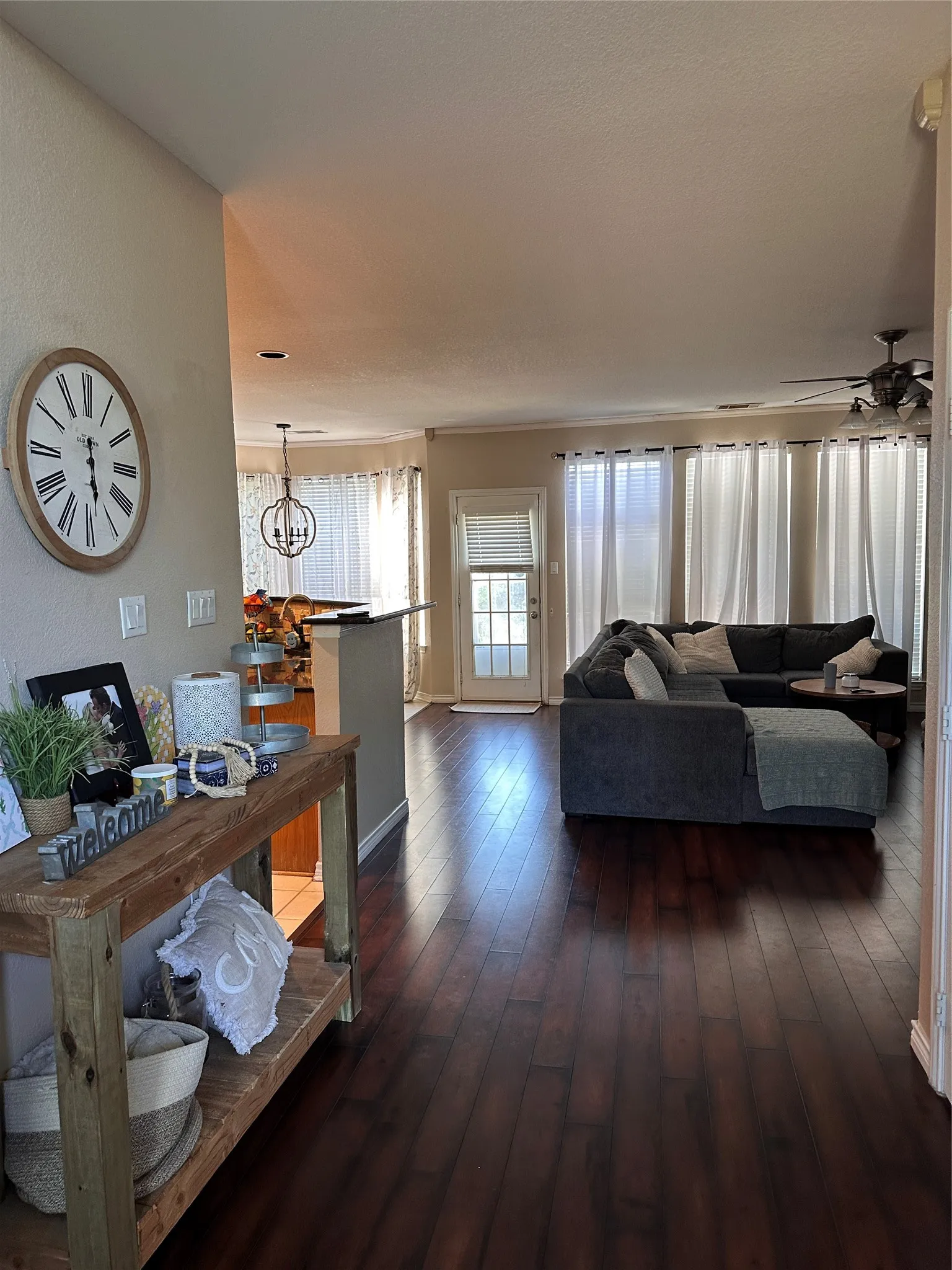 Rich wood-finish flooring extending into living areas