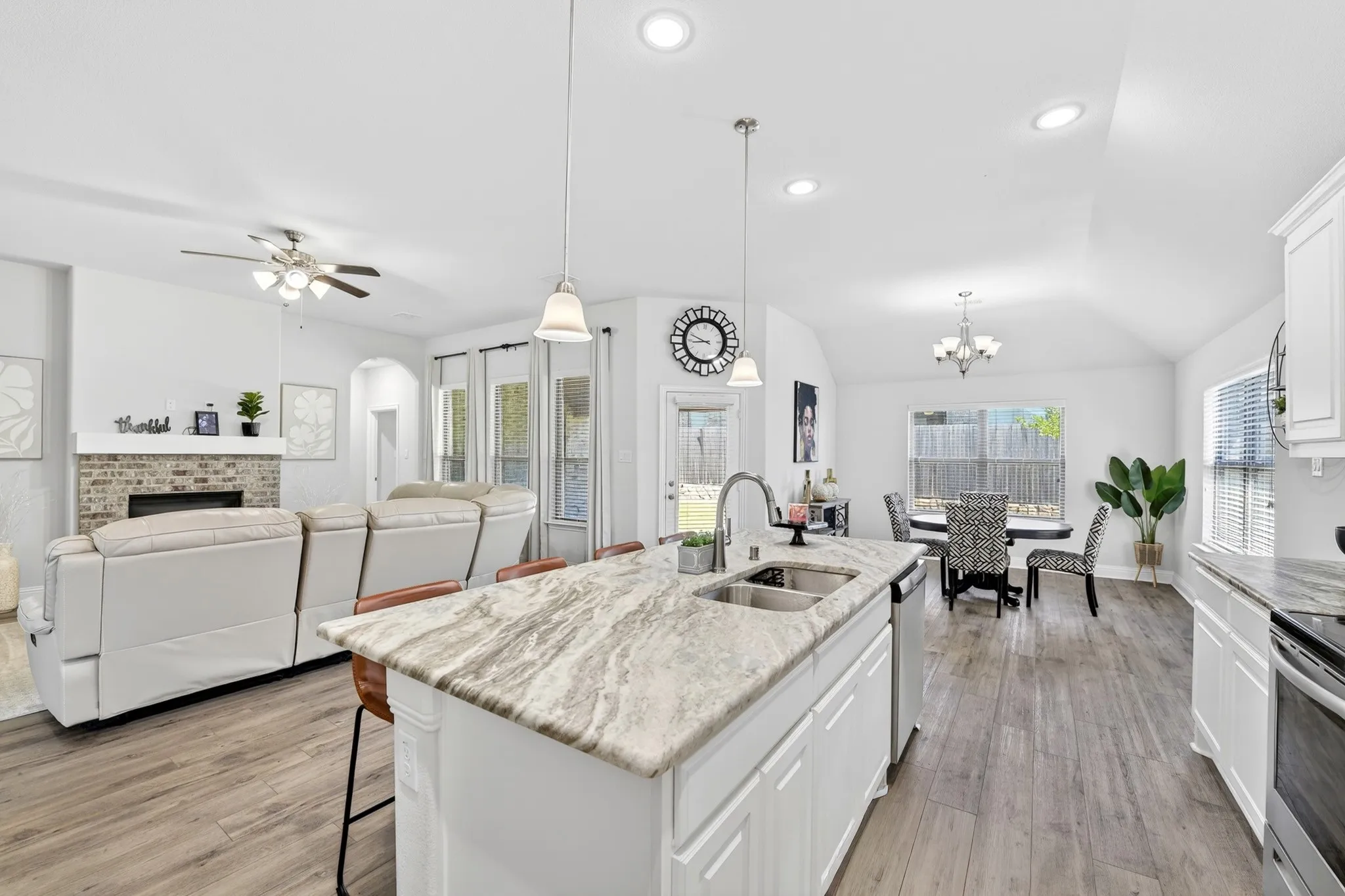 Kitchen island with double basin sink and extended countertop seating