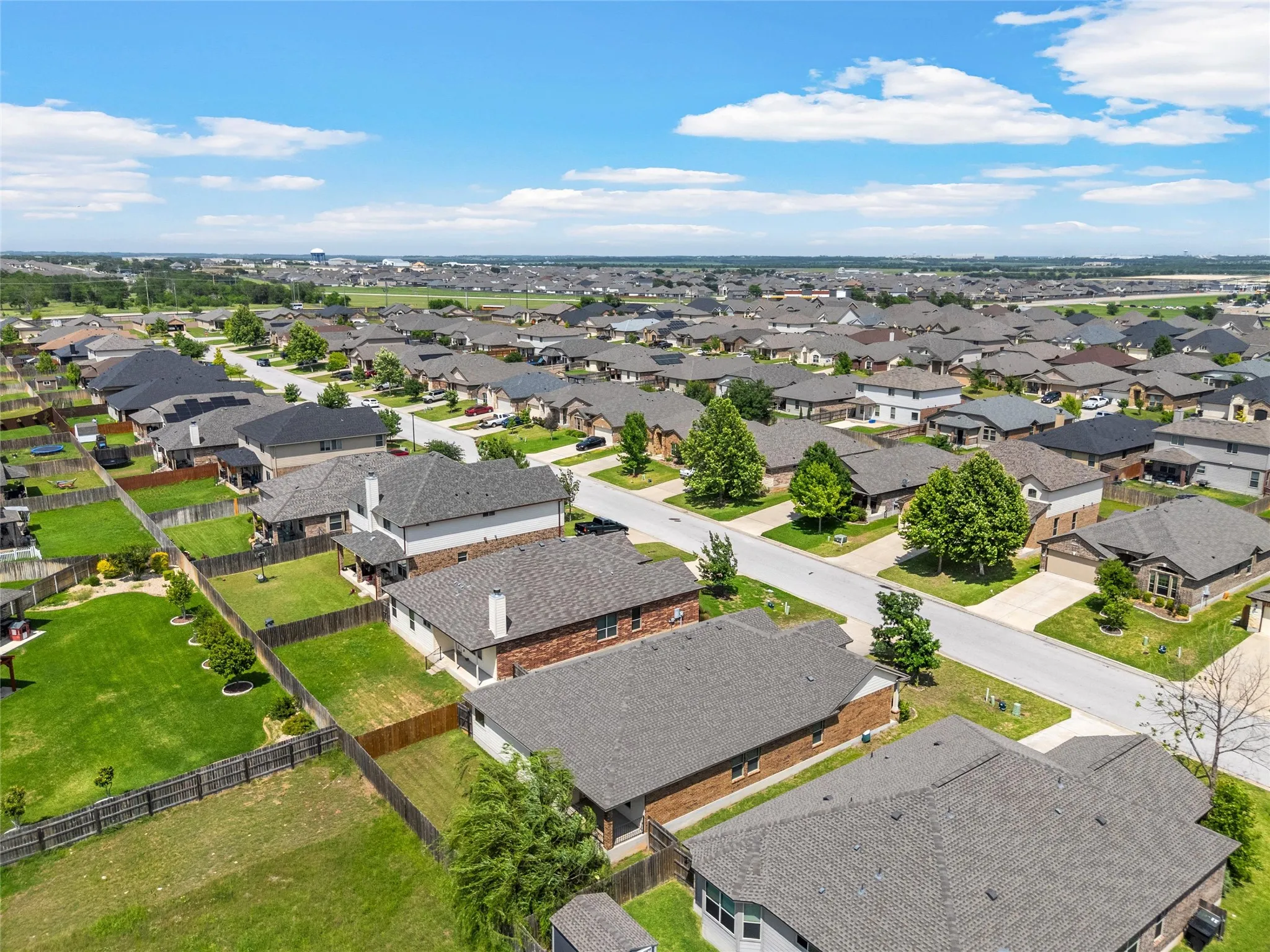 Aerial perspective showcasing a residential neighborhood with a consistent architectural style
