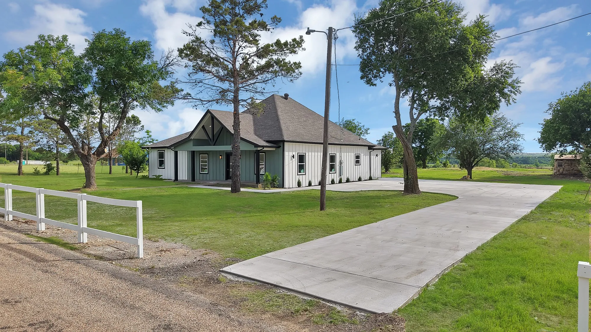 Crafted exterior featuring board and batten siding with a gabled entry
