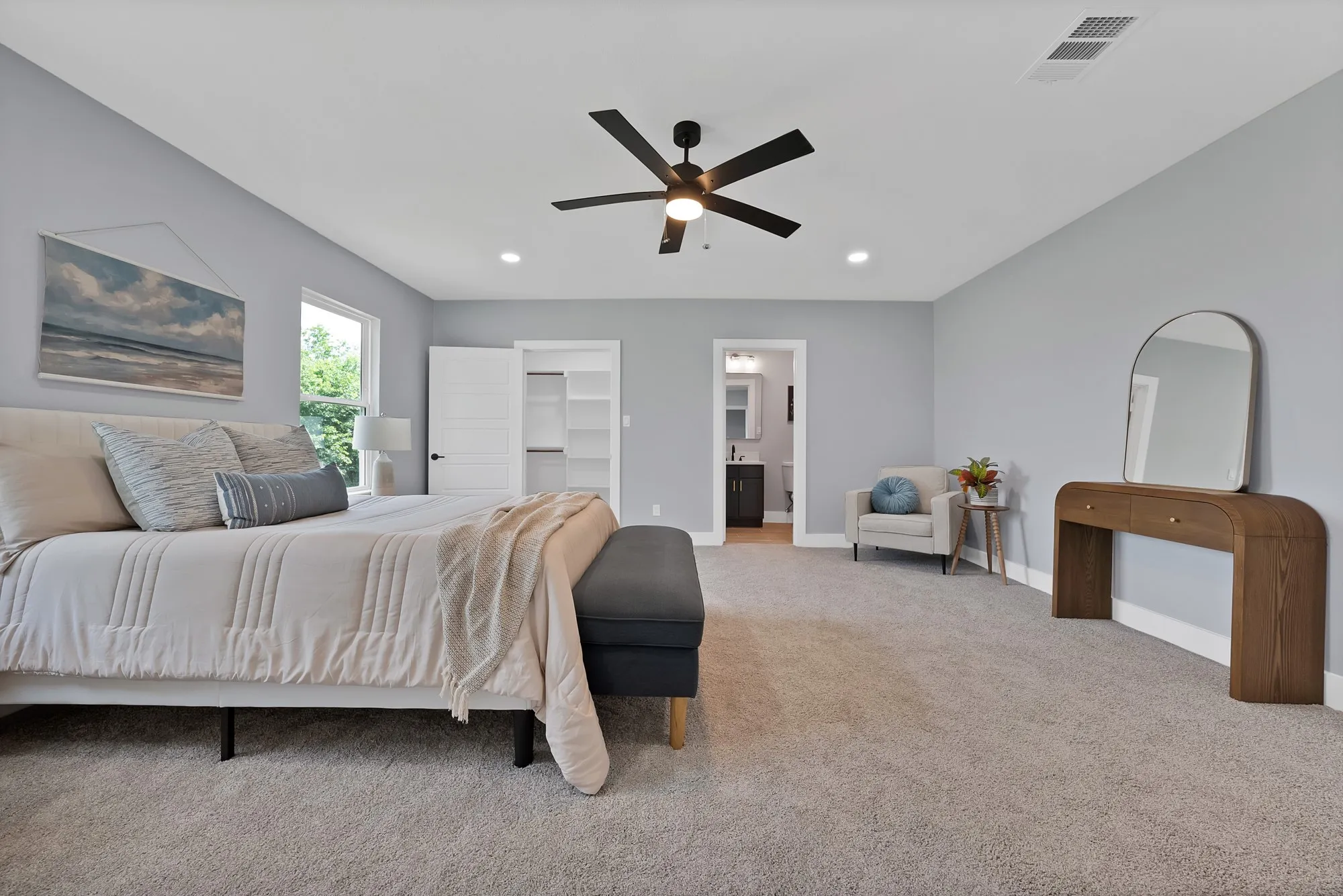 Spacious room featuring vaulted ceilings, recessed lighting, a modern ceiling fan, large windows, and carpeted flooring
