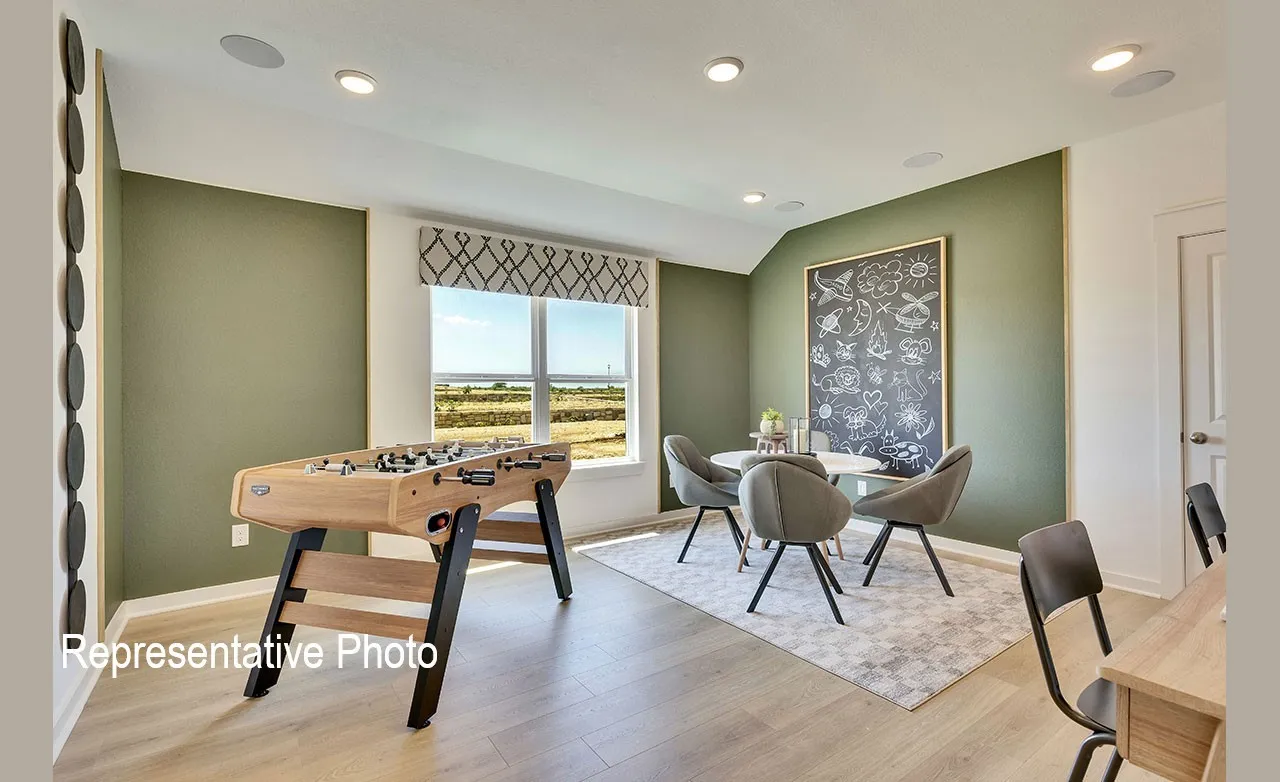 Spacious bonus room featuring wood-finish flooring, recessed lighting, and a large window with a patterned valance