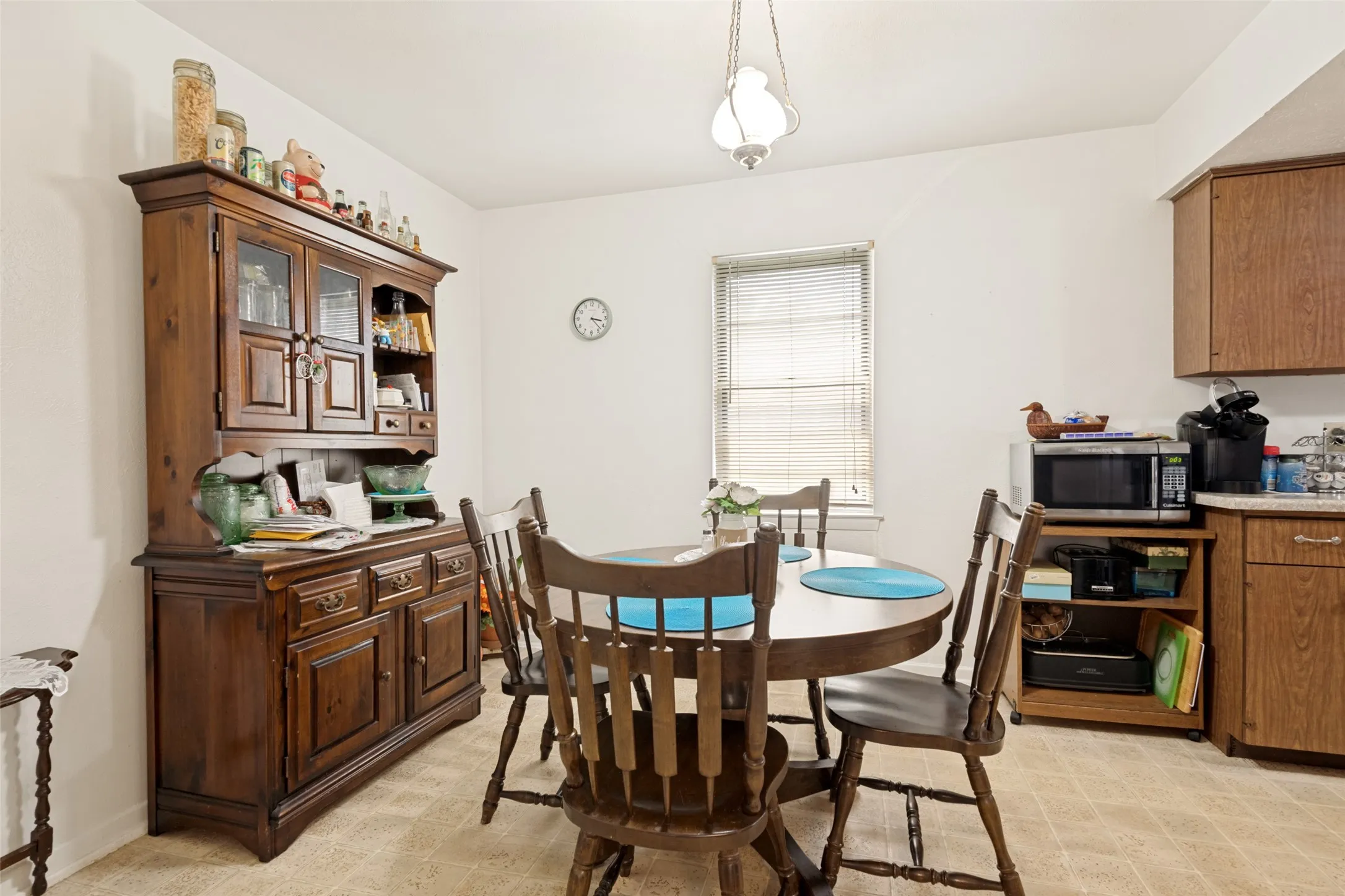 Open-concept dining area featuring a neutral color palette