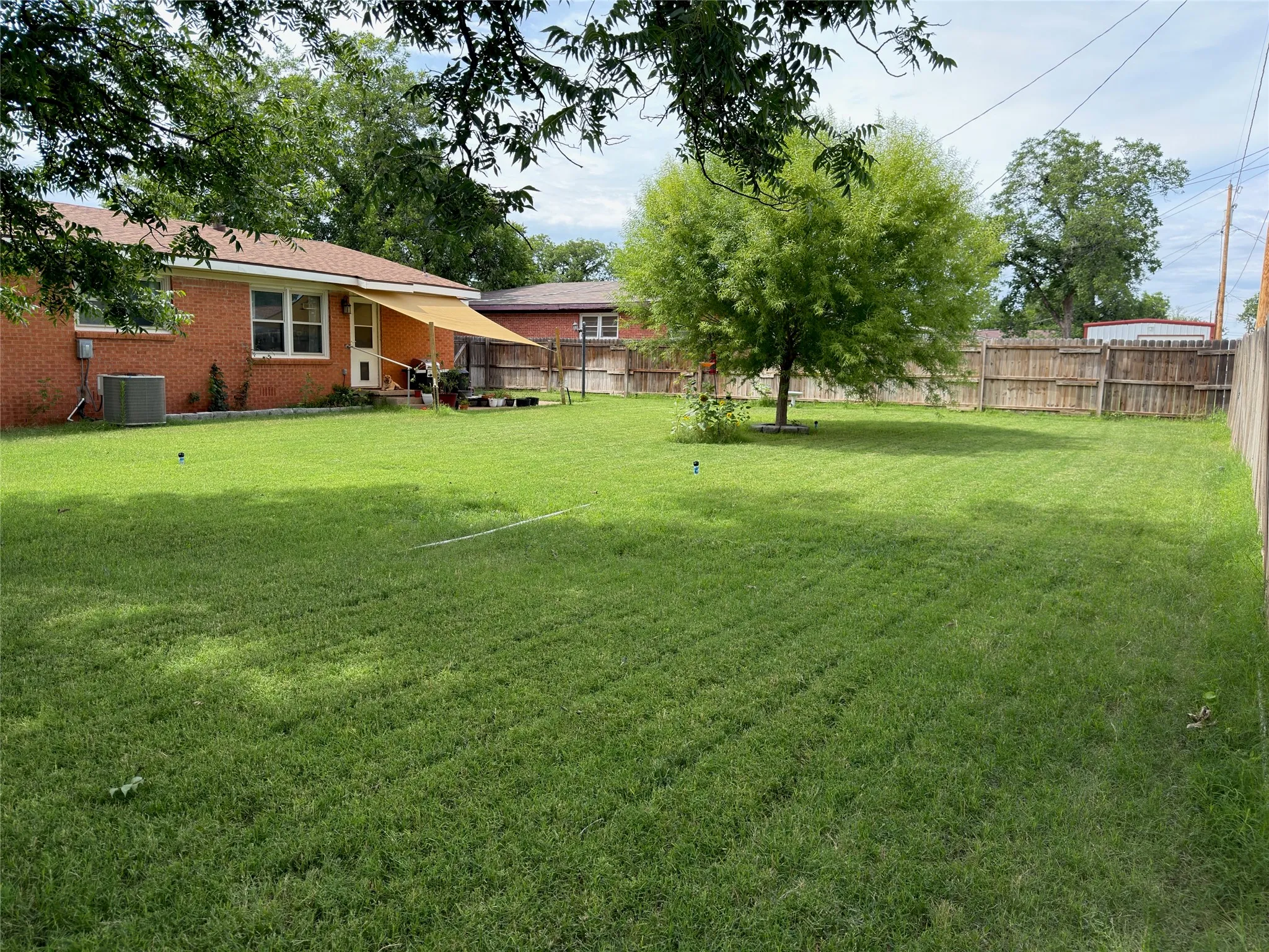 Expansive green lawn providing ample outdoor space