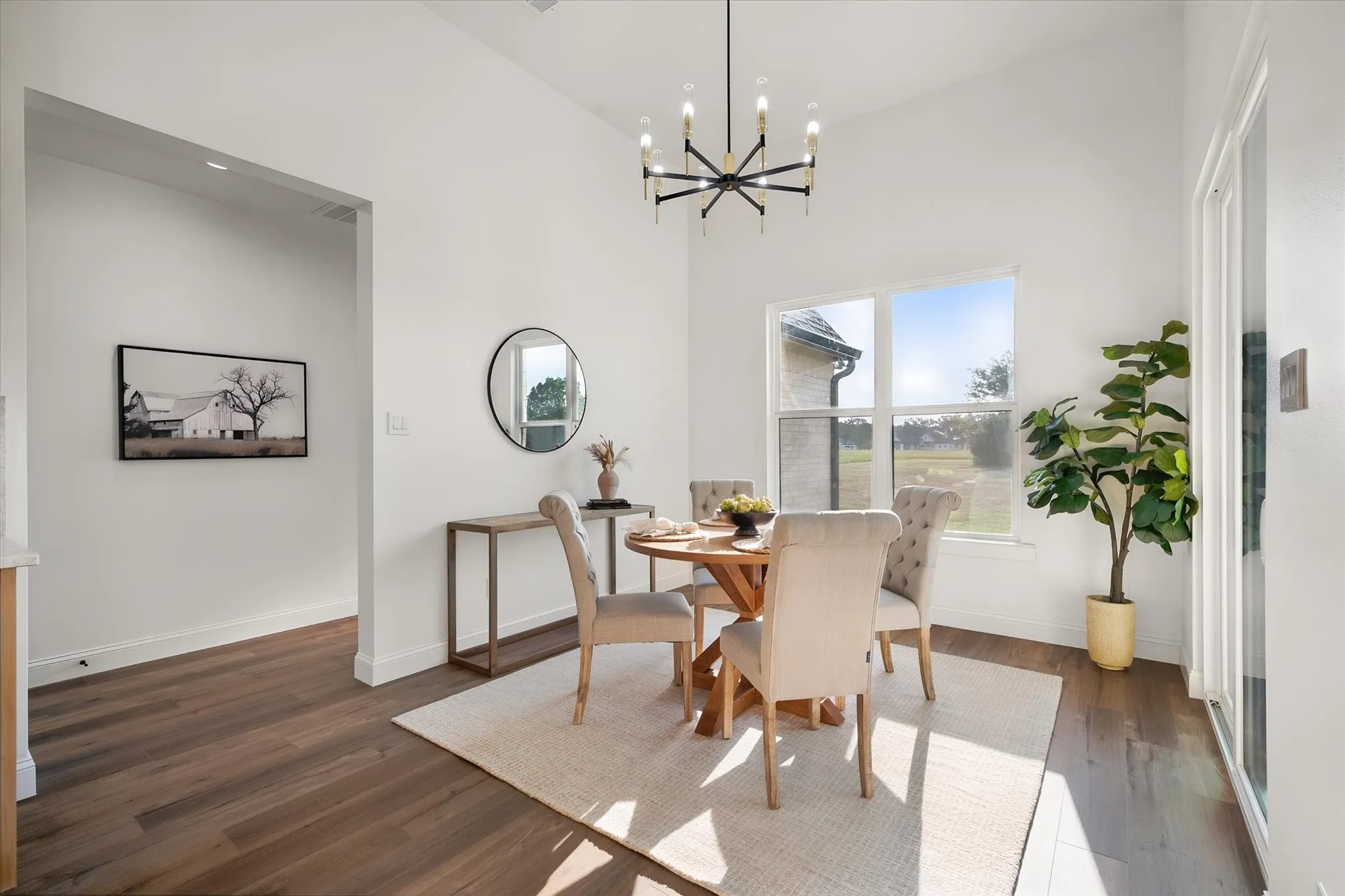 Casual dining area is surrounded by windows for a bright and cheerful everyday gathering space.