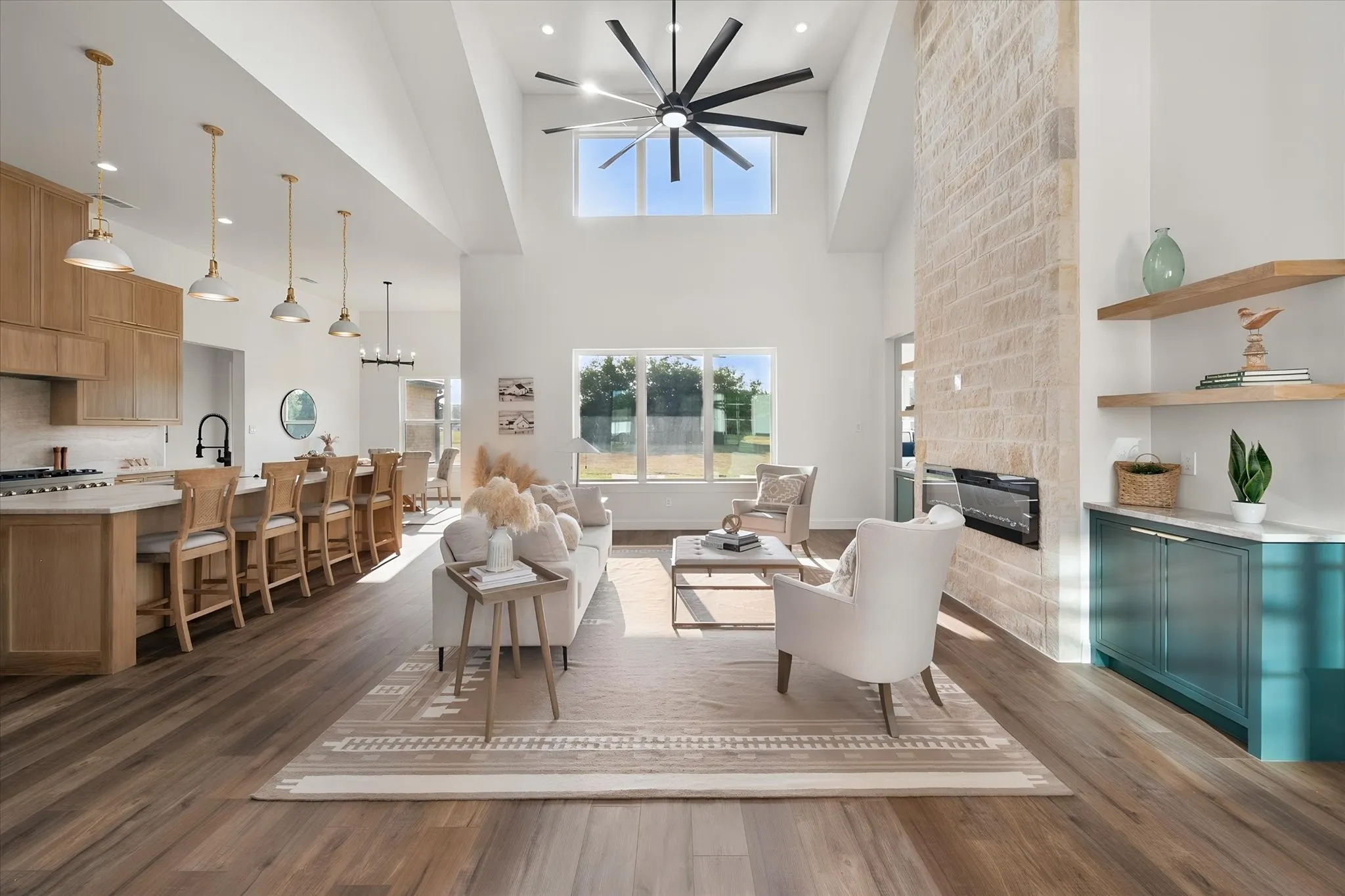 Soaring ceilings and an open layout connect the living room and kitchen for effortless entertaining.