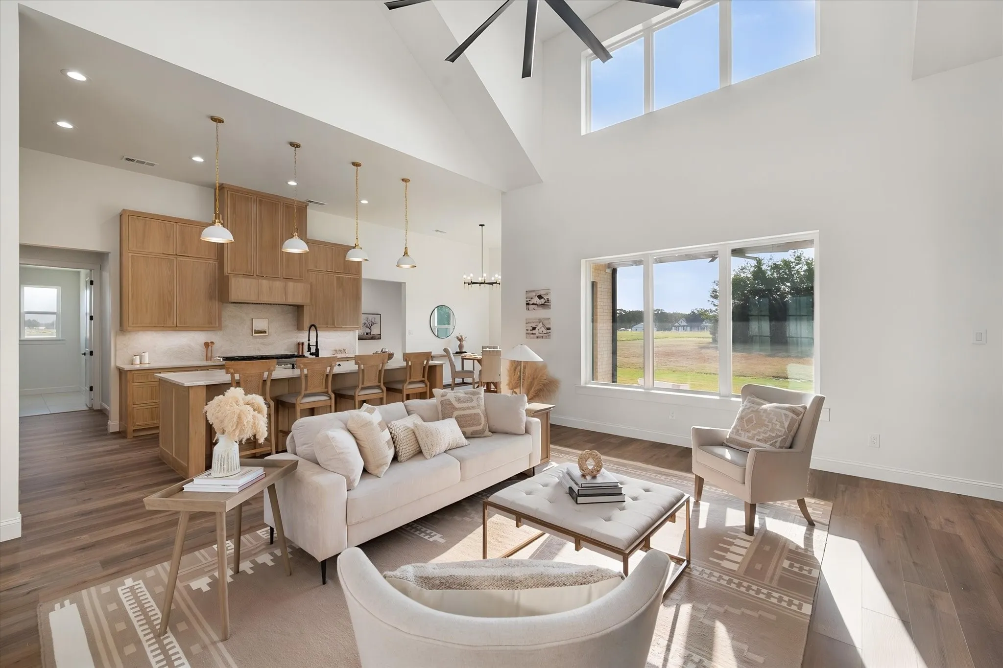 Sun-filled open floor plan combines modern farmhouse style with generous everyday living space.