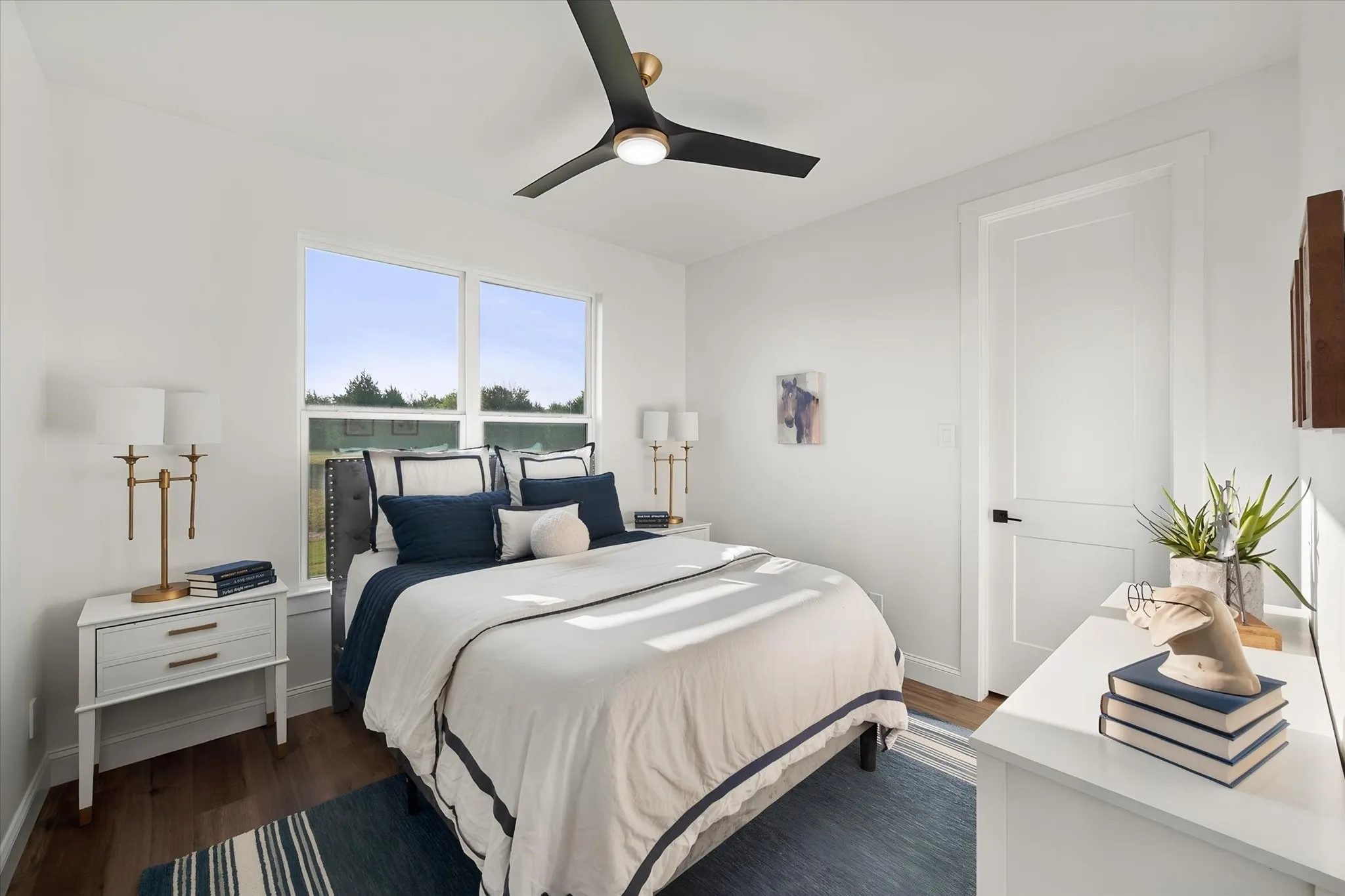 Bright secondary bedroom provides flexible space for family, guests, or everyday living.