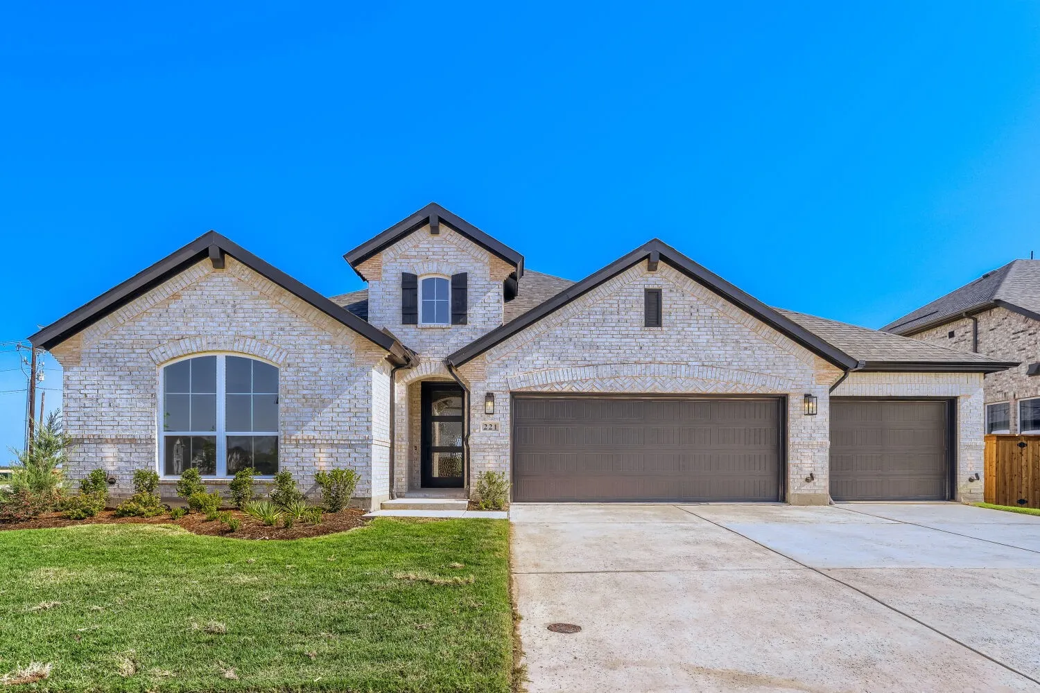 Stone veneer exterior with dark trim accents