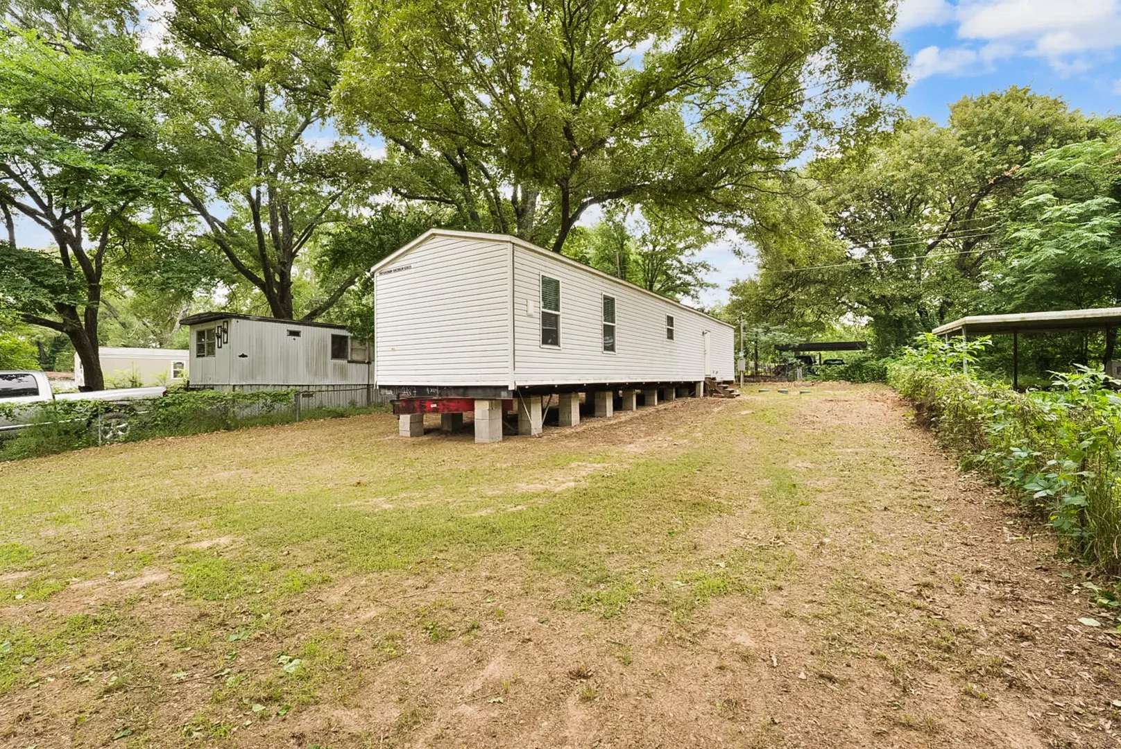 White siding residence on concrete block foundation