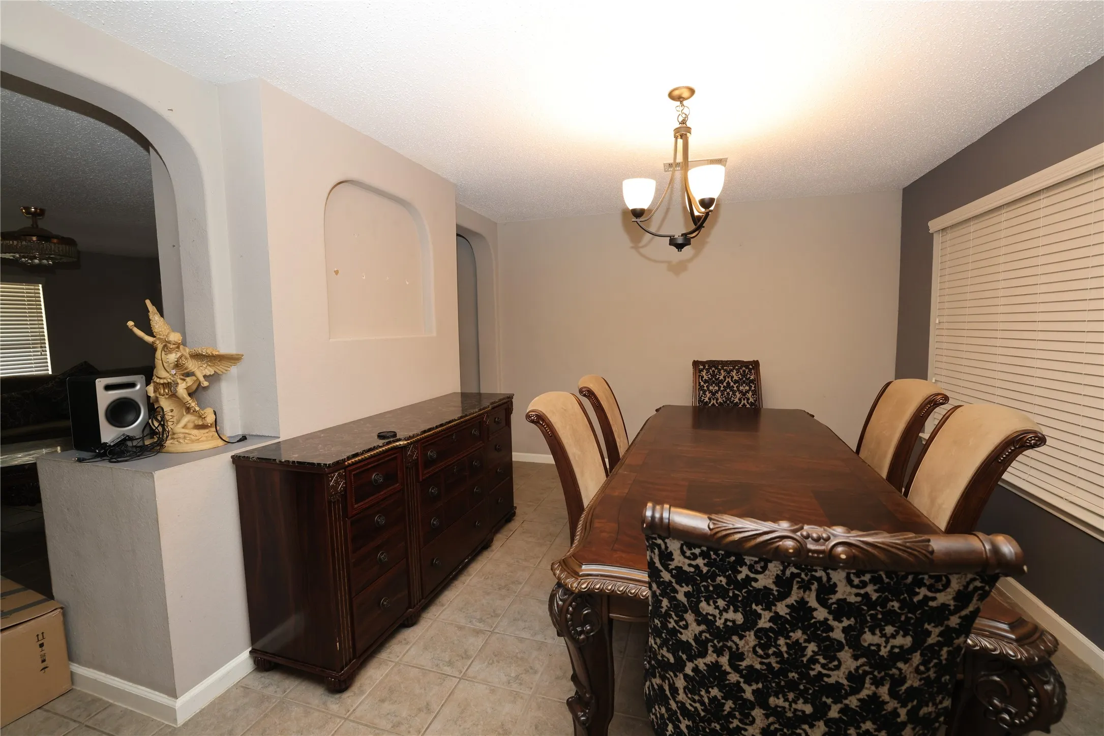 Recessed wall niche, arched doorway, and neutral-toned walls
