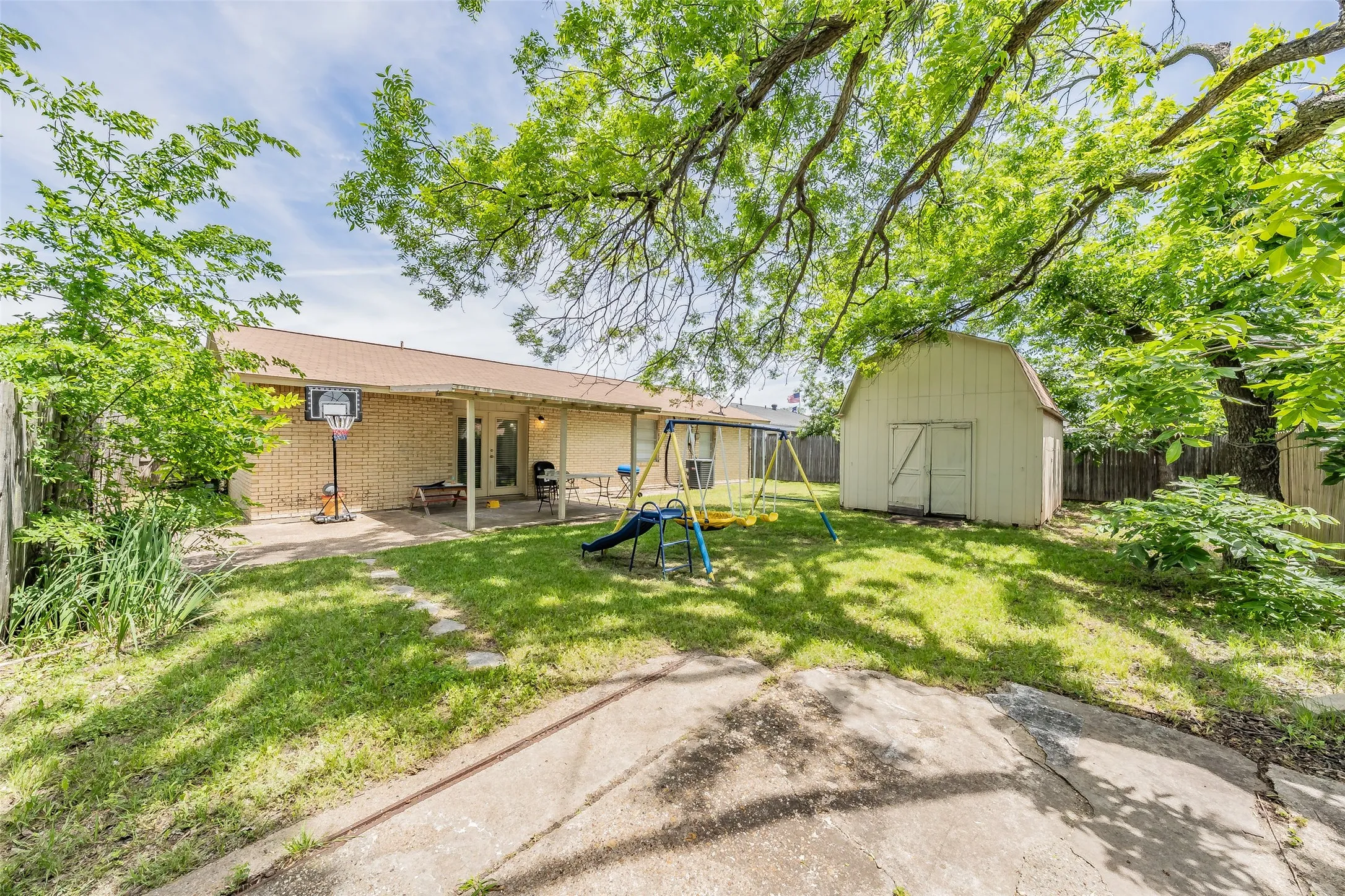 Backyard and storage shed.