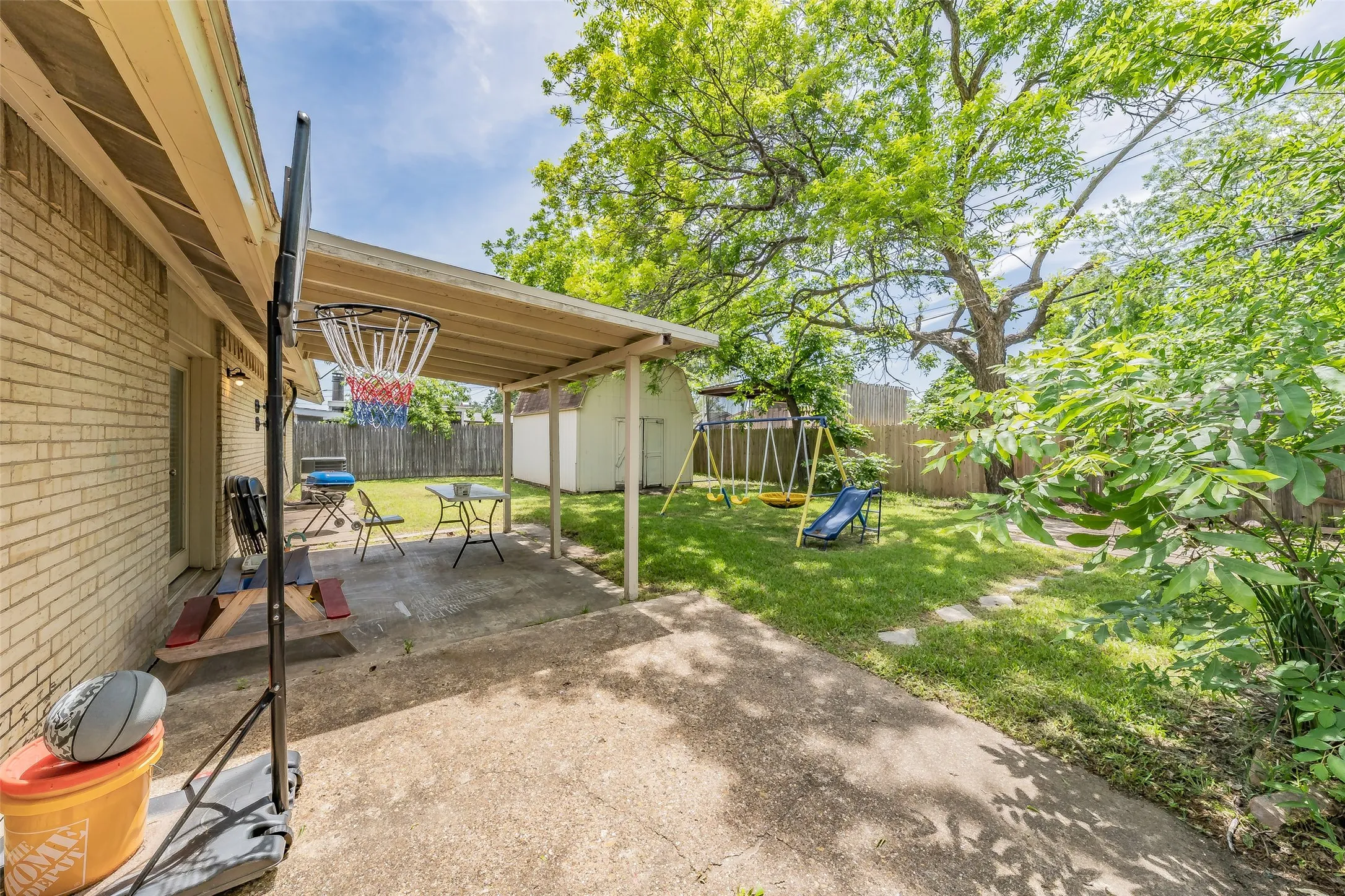 Covered patio in backyard.