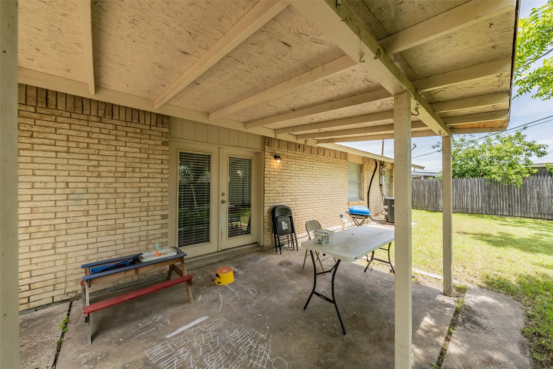Covered patio featuring a concrete slab.