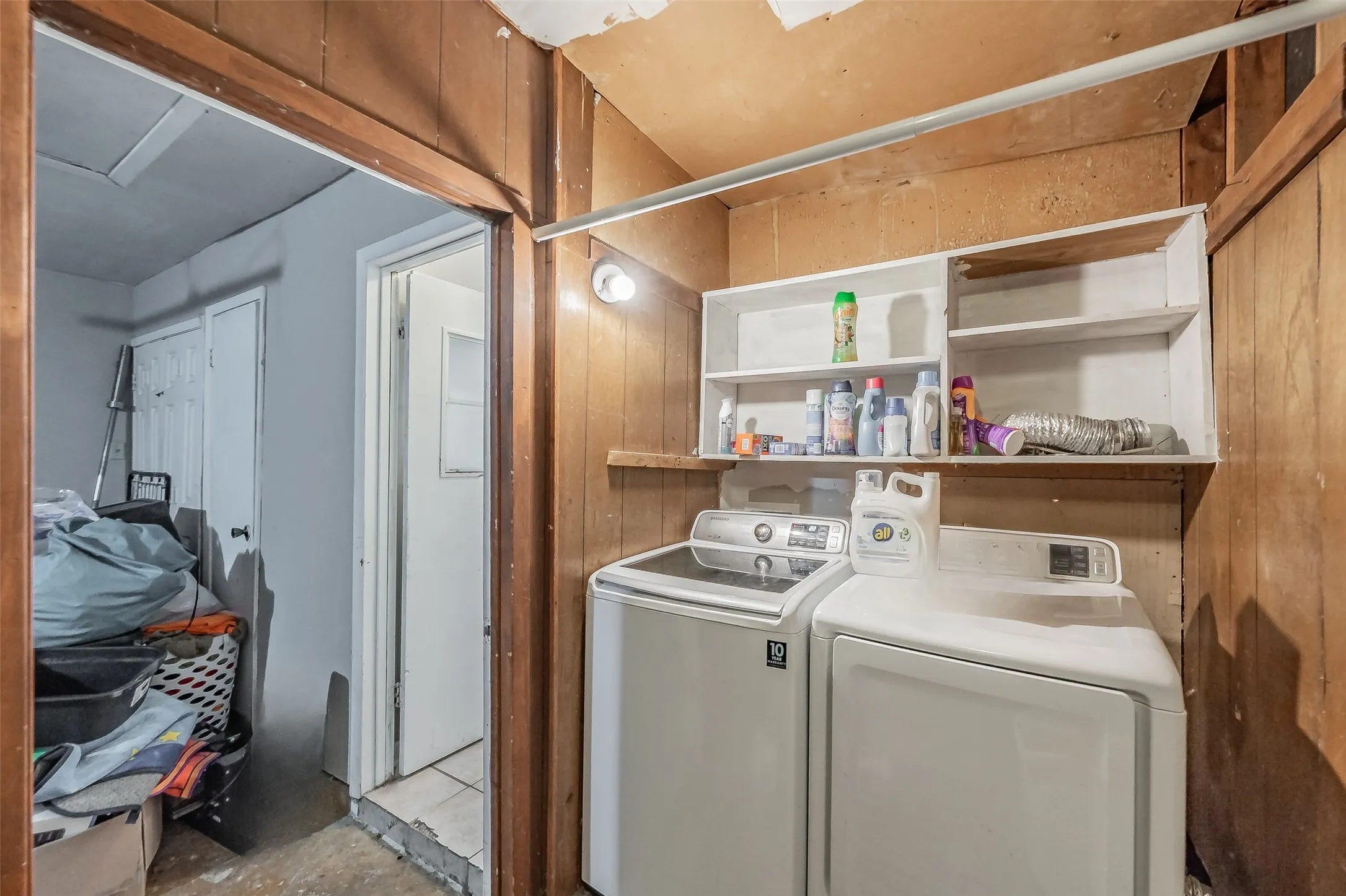 Laundry room in garage with space for full size washer & dryer.