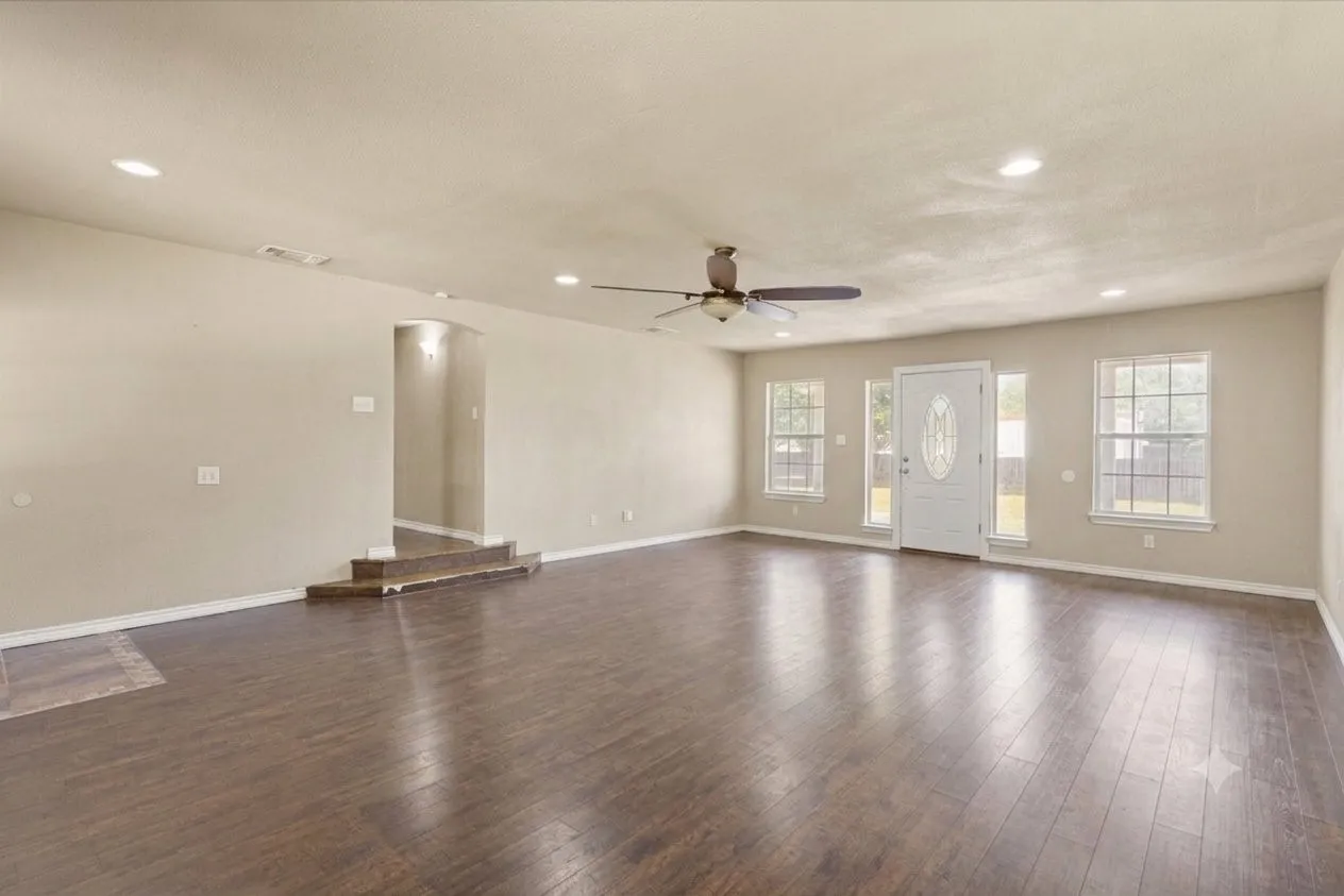 Photo digitally edited using AI to remove furniture/personal items. Property shown in as-is condition