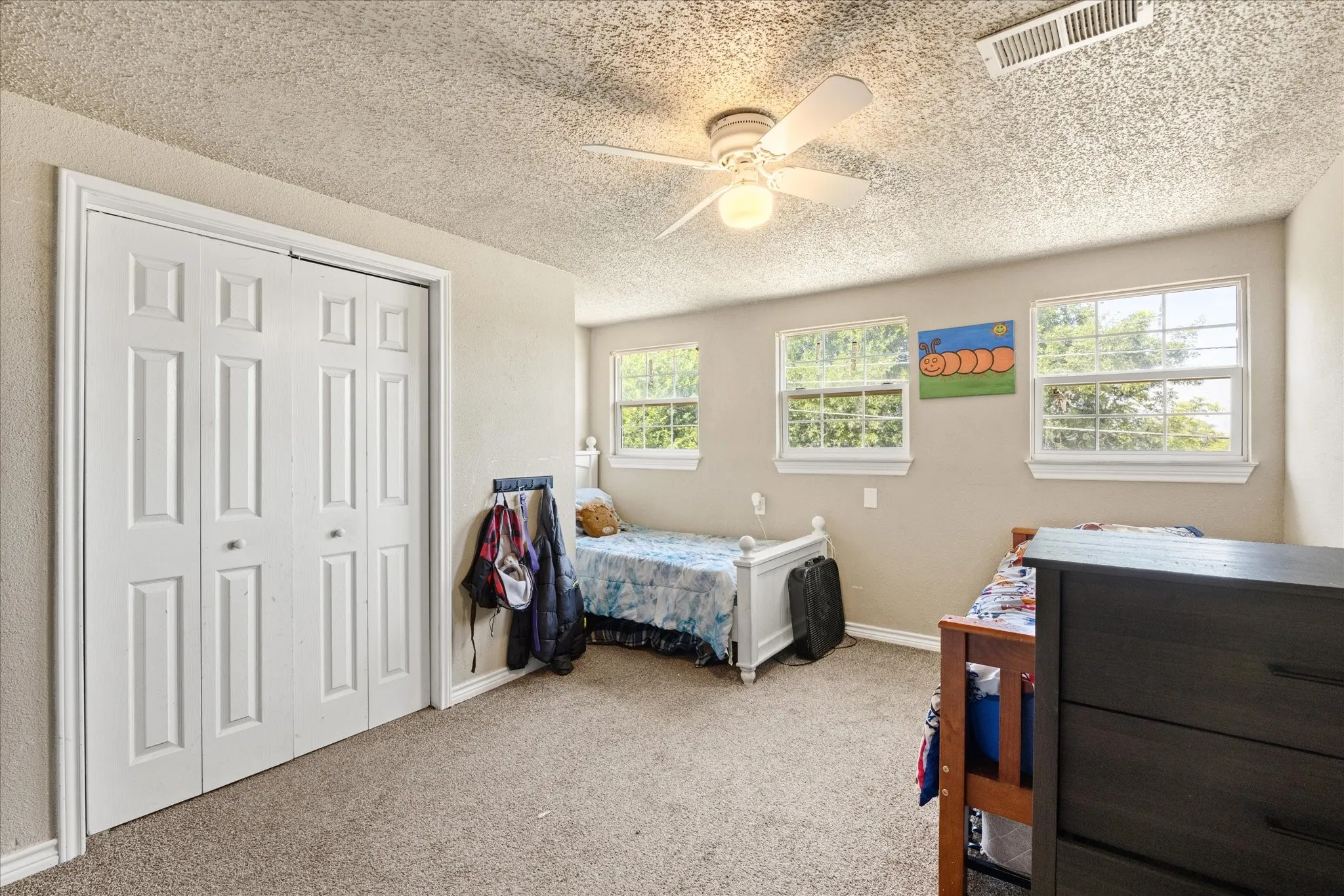 One of two secondary bedrooms upstairs.