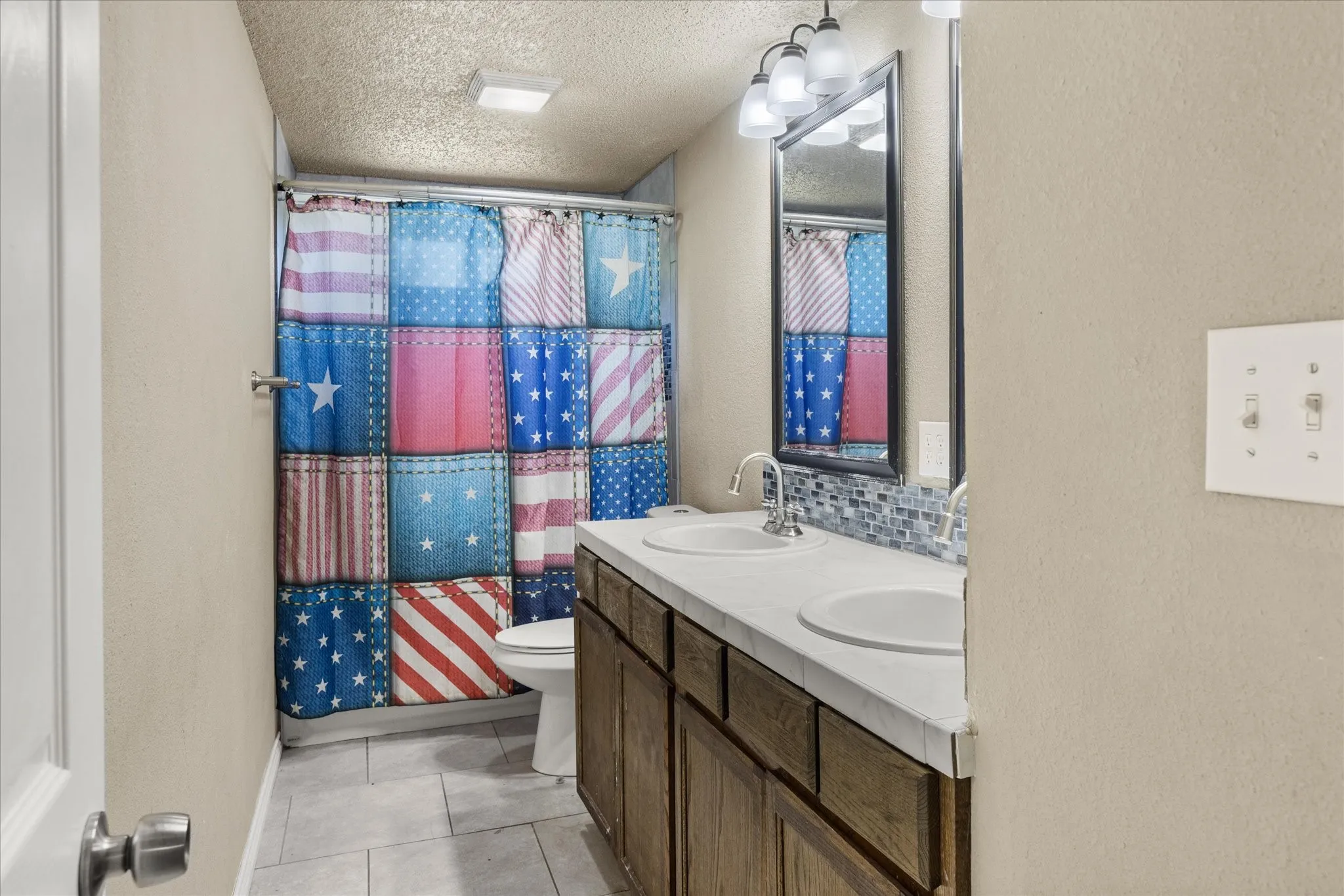 Upstairs hall bathroom, serves two bedrooms.